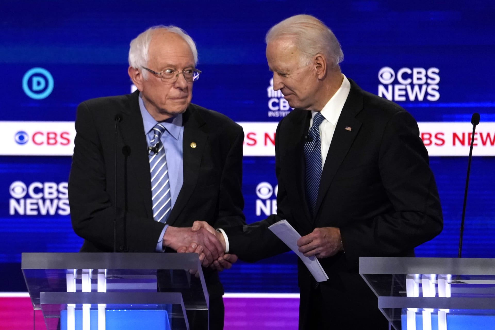 <p>Presidential candidates Senator Bernie Sanders (L) and former Vice President Joe Biden (R) shake hands at the February 25 Democratic debate in Charleston, South Carolina. </p>
