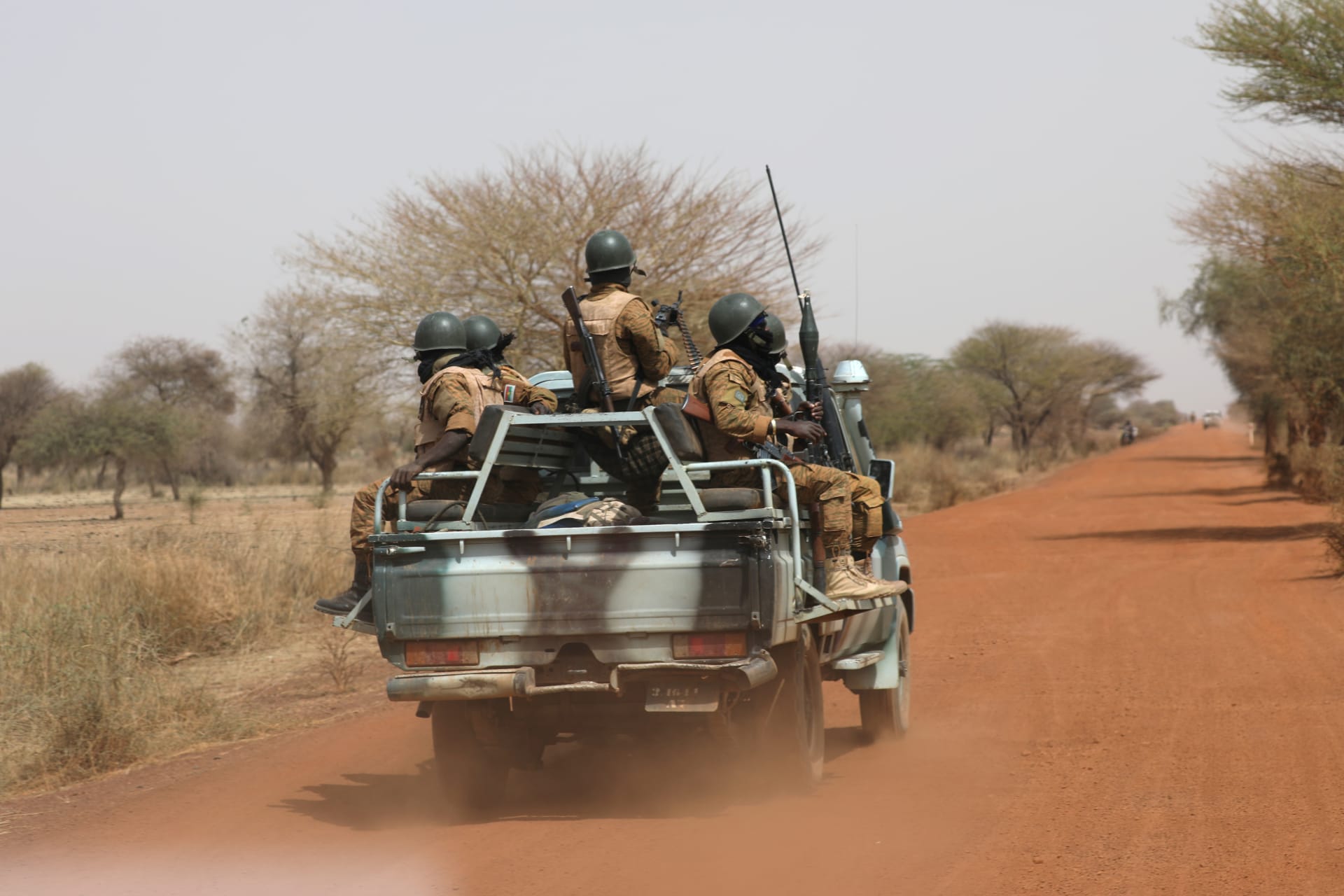 <p>Soldiers from Burkina Faso patrol on the road of Gorgadji in Sahel area, Burkina Faso, on March 3, 2019.</p>
