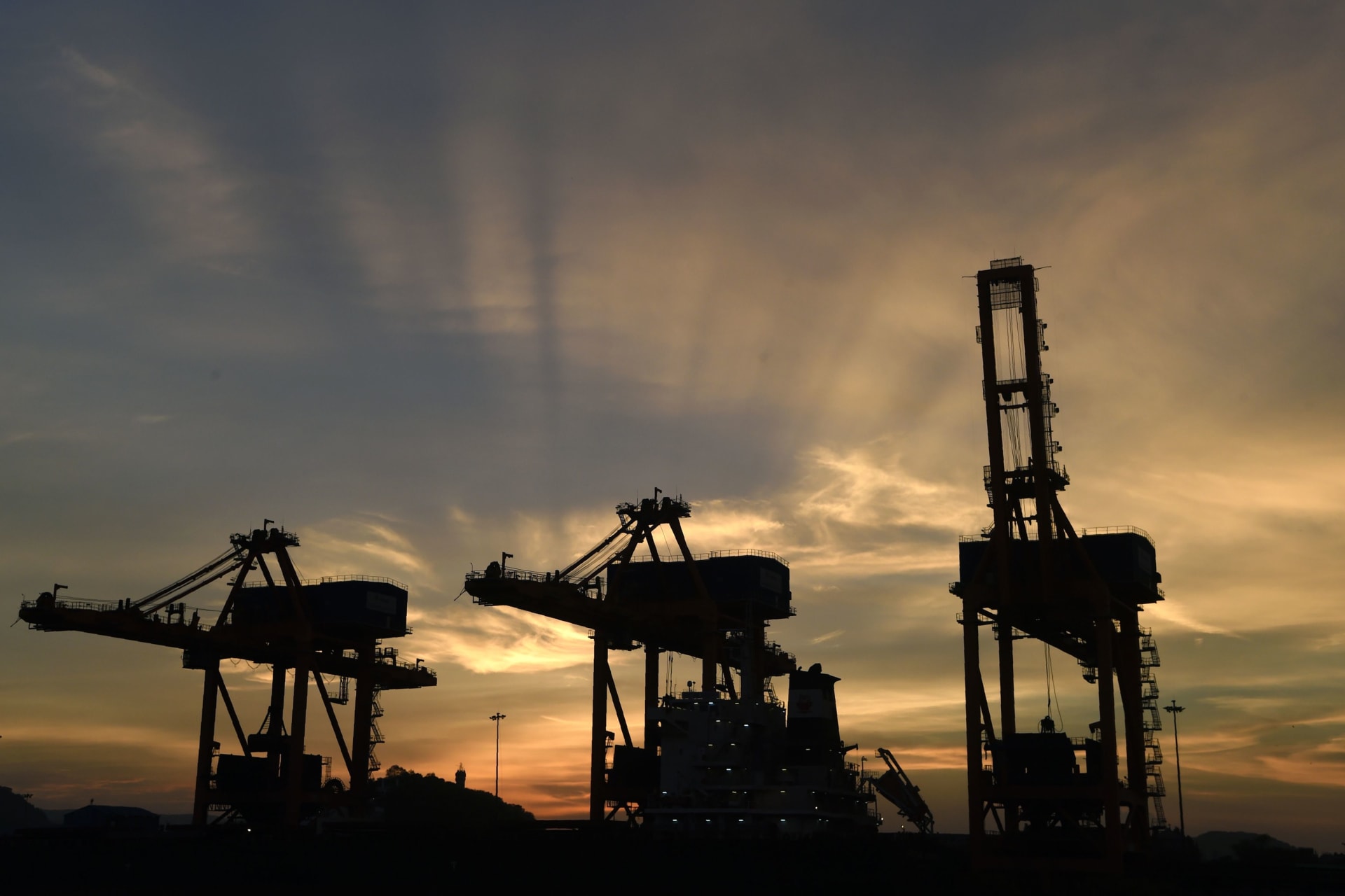 <p>Iron ore unloaders in the port of Visakhapatnam, India.</p>
