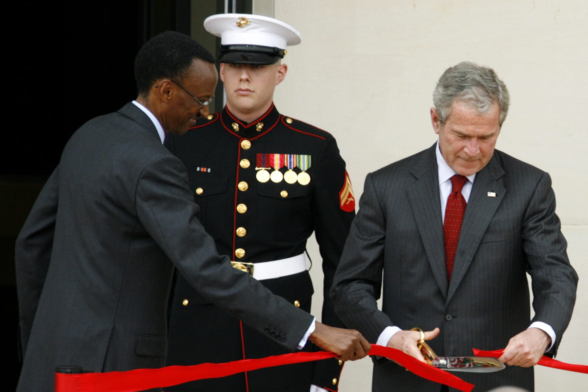 <p>U.S. President George W. Bush and his Rwandan counterpart Paul Kagame cut a ribbon to officially open the U.S. Embassy in the capital of Kigali, on February 19, 2008.</p>
