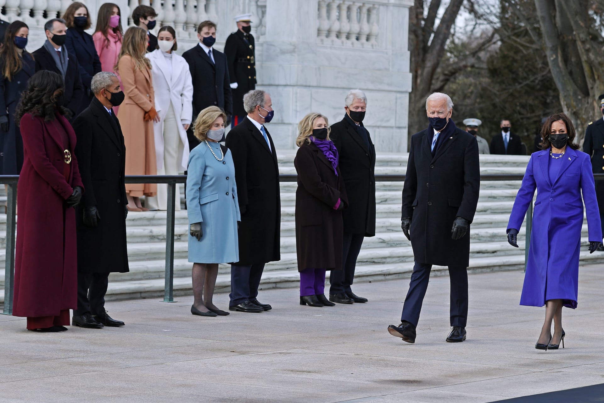 <p>President Joe Biden and Vice President Kamala Harris arrive at Arlington National Cemetery’s Tomb of the Unknown Soldier on January 20, 2021, as former Presidents Barack Obama, George W. Bush, and Bill Clinton look on with their wives. </p>
