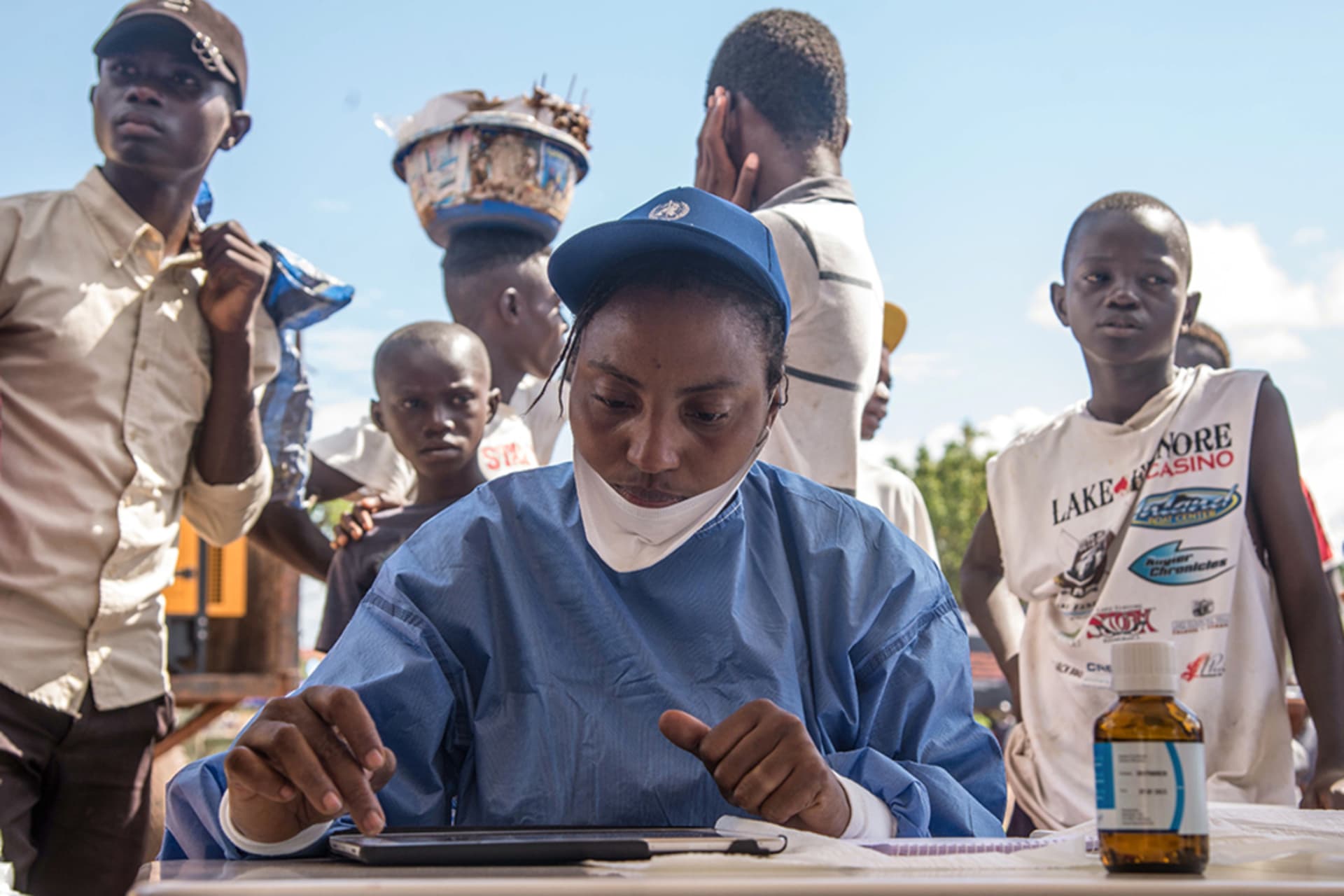 <p>A nurse working with the WHO prepares Ebola vaccines in the Democratic Republic of Congo.</p>
