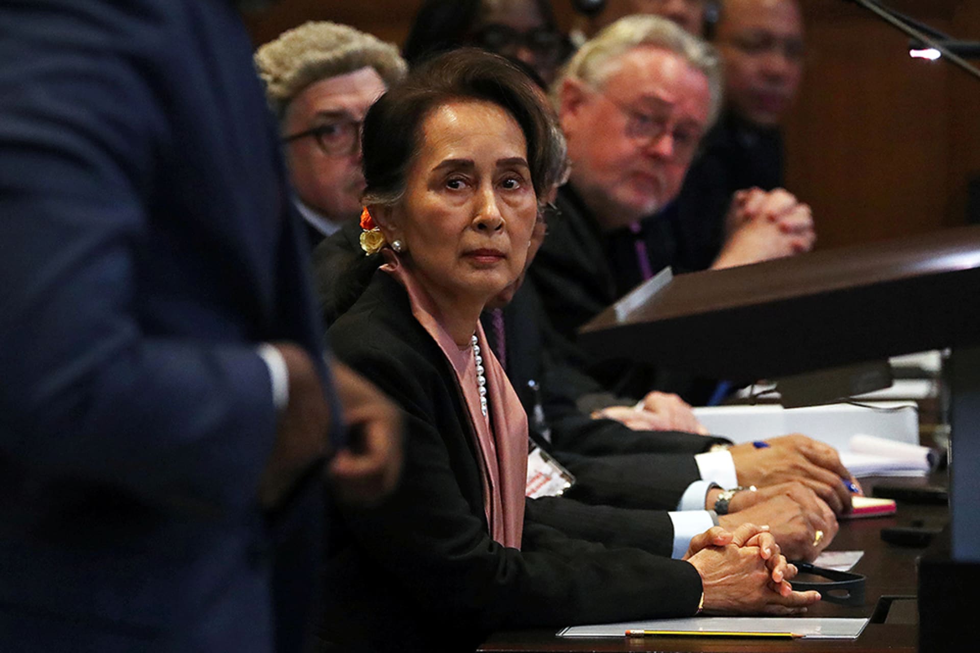 <p>Myanmar leader Aung San Suu Kyi listens as Gambian Justice Minister Abubacarr Tambadou speaks at a hearing at the International Court of Justice in The Hague, Netherlands.</p>
