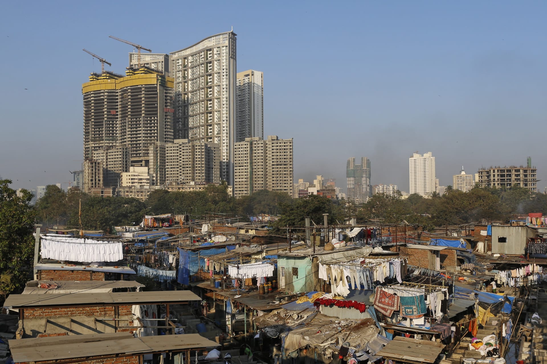 <p>A laundry and high-rise buildings in Mumbai, India</p>
