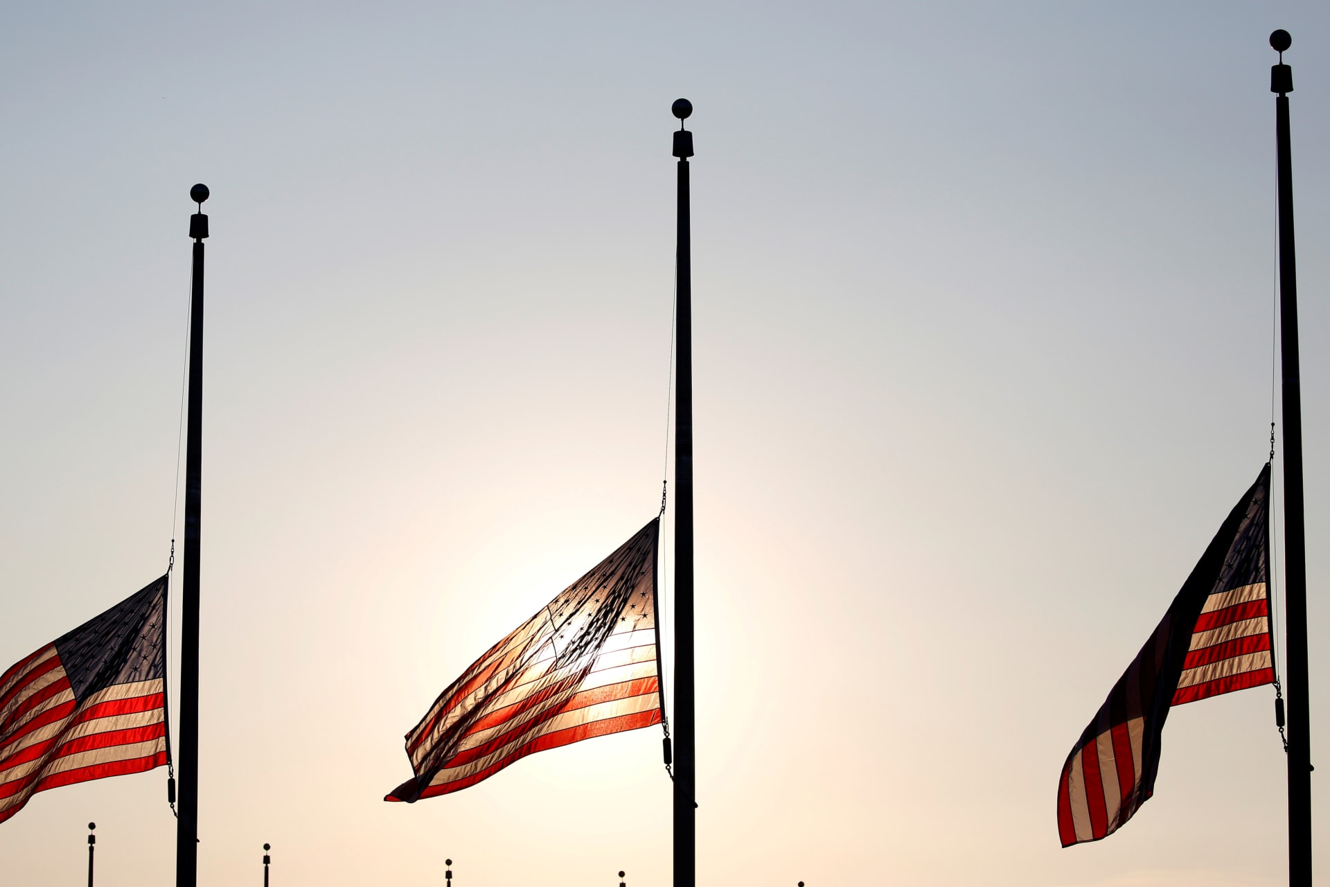 <p>Flags fly at half-staff at the Washington Monument in Washington, DC. Joshua Roberts/REUTERS</p>
