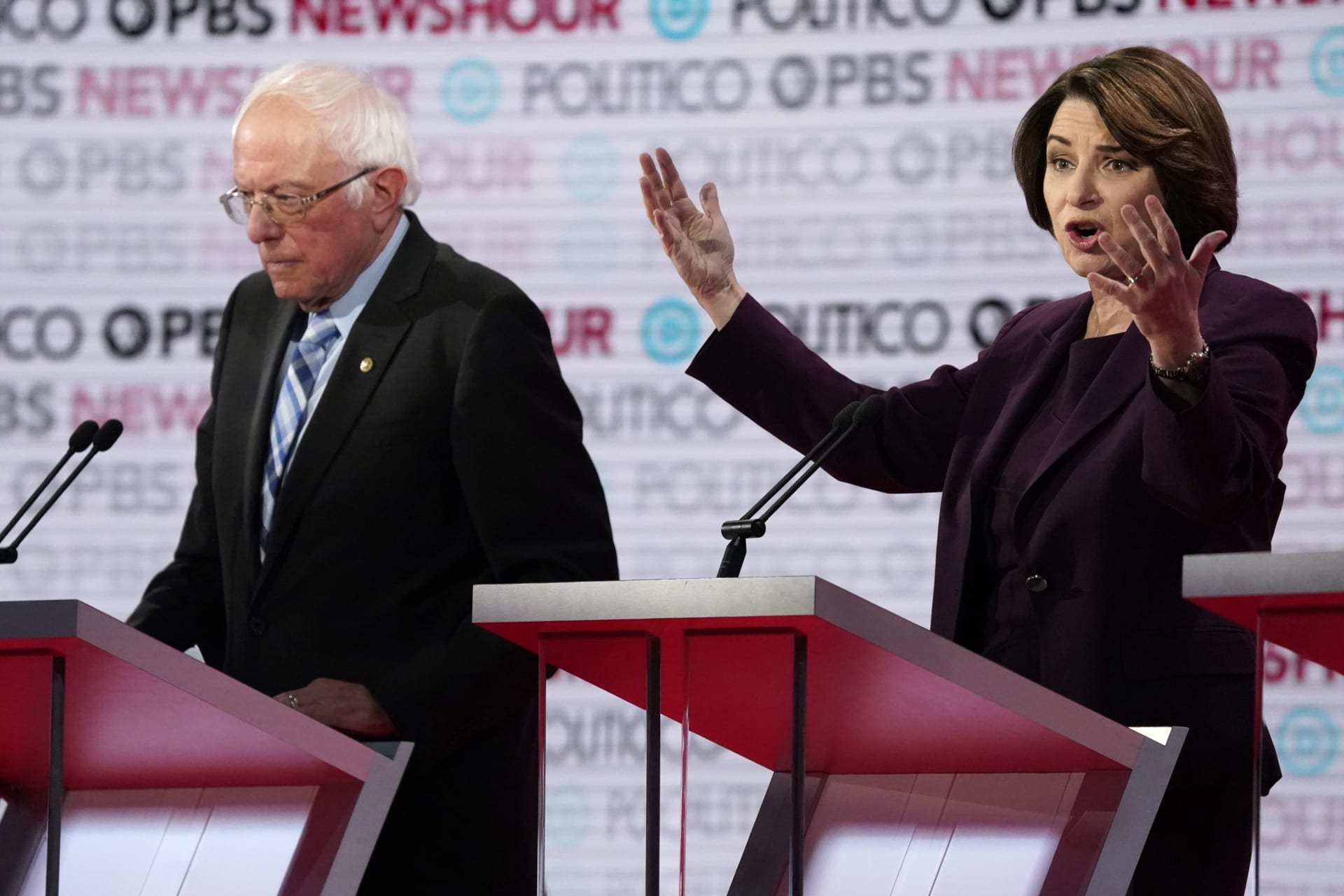 <p>Senator Bernie Sanders listens to Senator Amy Klobuchar speak at the Democratic presidential debate on December 19. </p>
