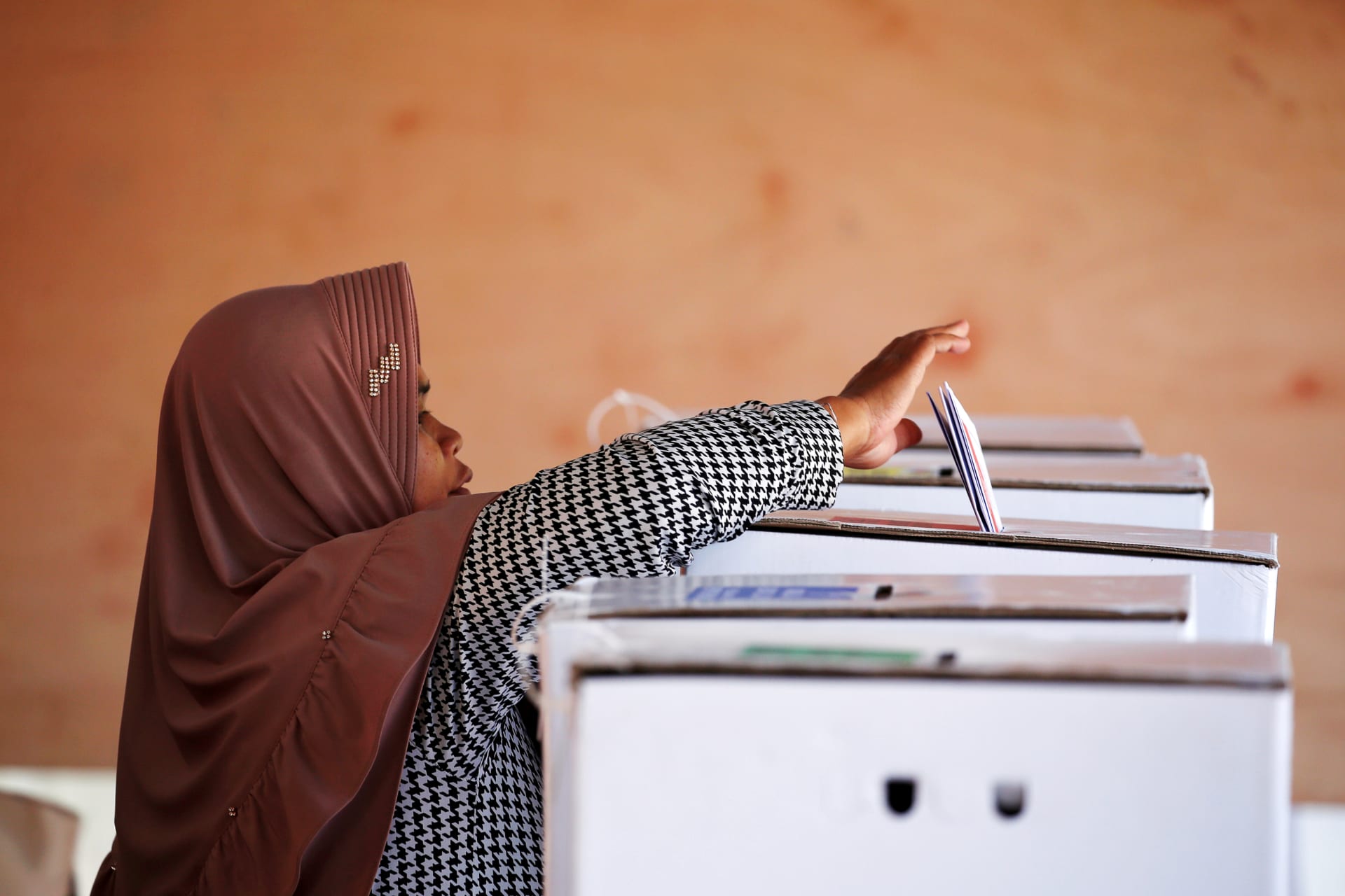<p>A voter casts her ballot during elections in Bogor, West Java, Indonesia on April 17. Willy Kurniawan/REUTERS</p>
