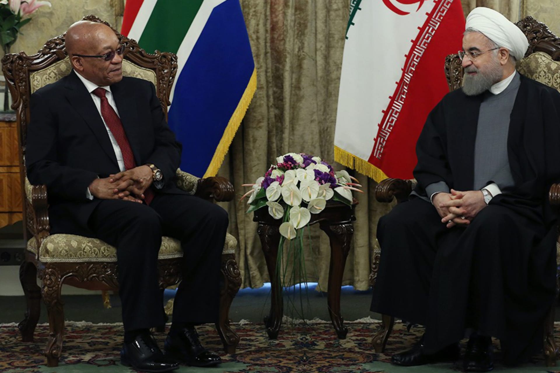 <p>President of South Africa Jacob Zuma (L) and Iran’s President Hassan Rouhani (R) are seen during their meeting at Sadabad Palace in Tehran, Iran, on April 24, 2016.</p>
