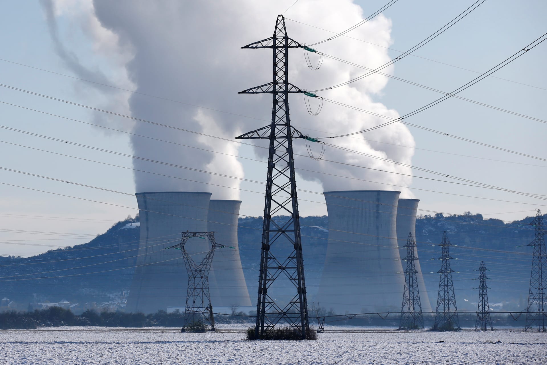 <p>Pylons of high-tension electricity power lines are seen near the Bugey Nuclear Power Plant after heavy snowfall in Saint -Vulbas, France</p>
