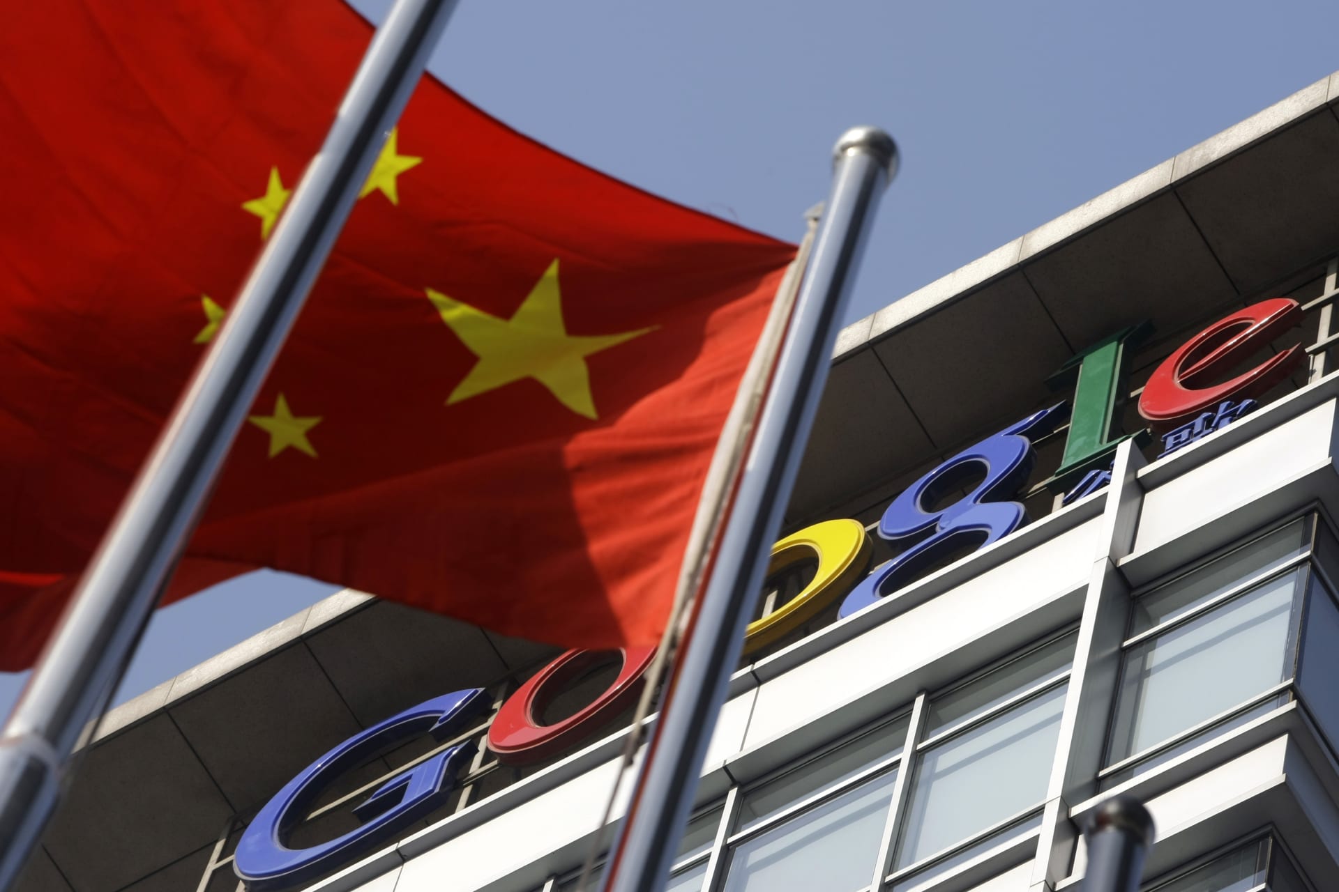 <p>A Chinese national flag flies in front of Google China’s headquarters in Beijing</p>
