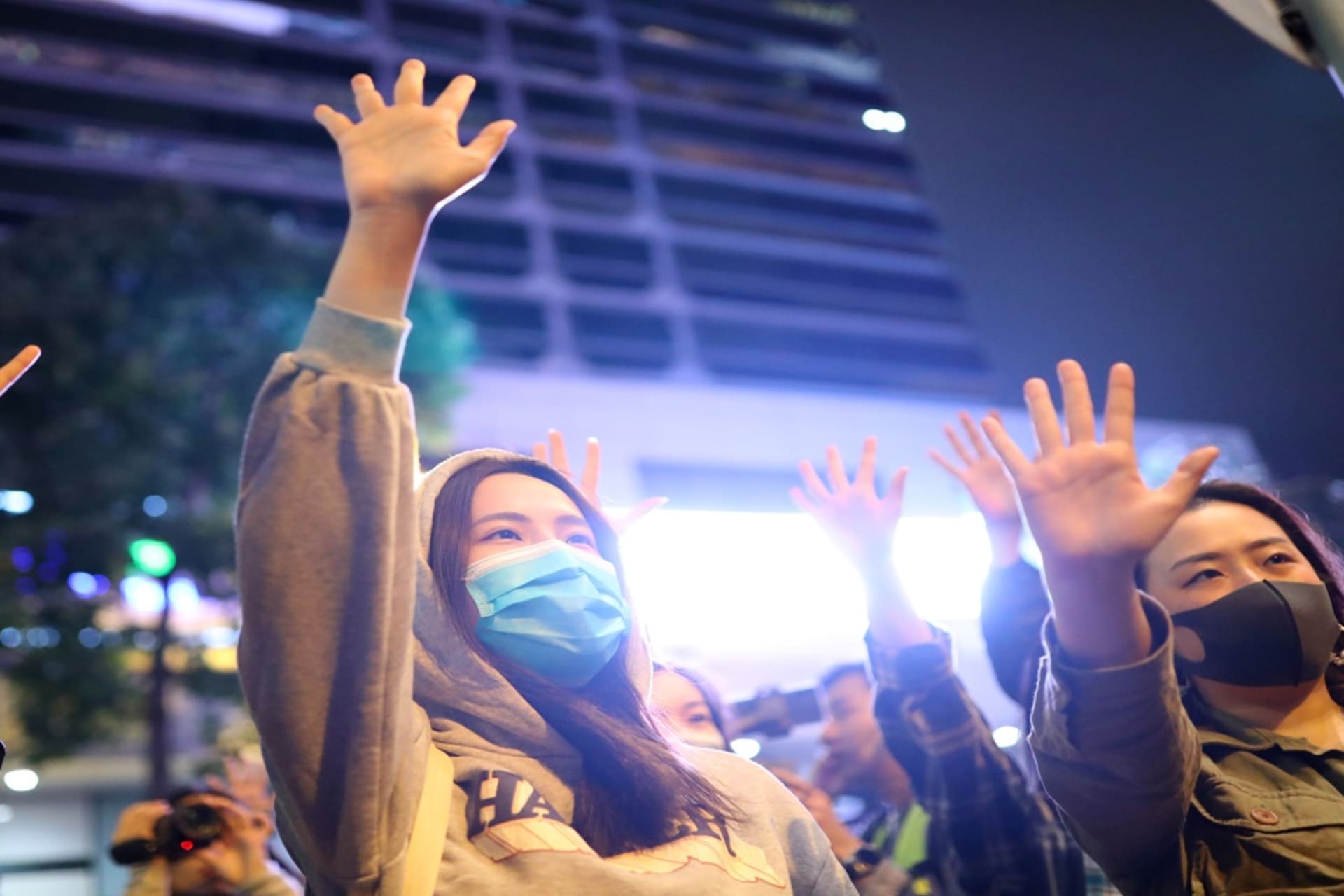 <p>Protesters raise their hands outside the Polytechnic University in Hong Kong on November 25, 2019. </p>
