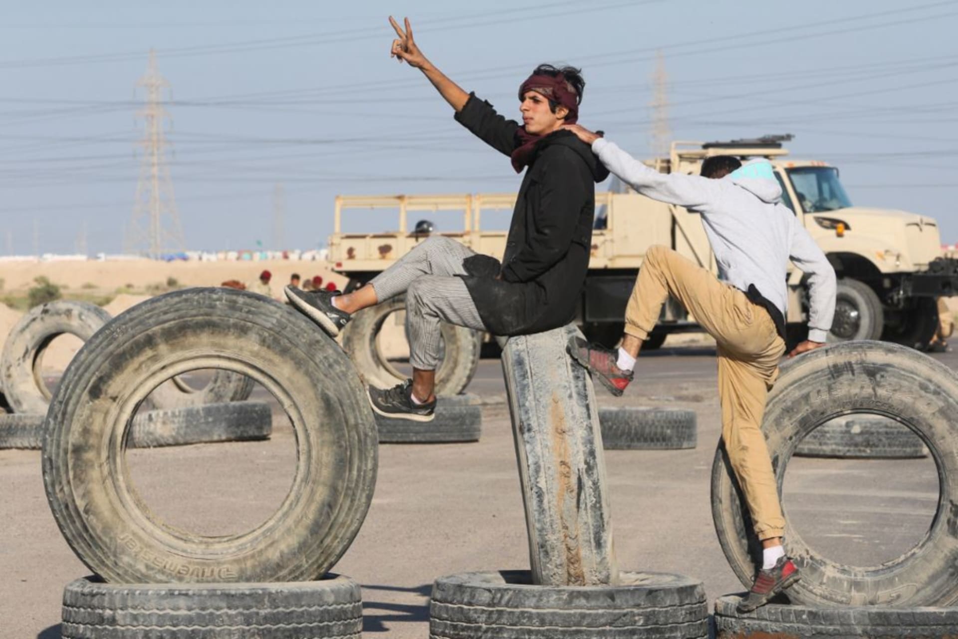 <p>Iraqi demonstrators block the entrance of Khor al-Zubair commodities port during the ongoing anti-government protests, near Basra, Iraq November 19, 2019.</p>
