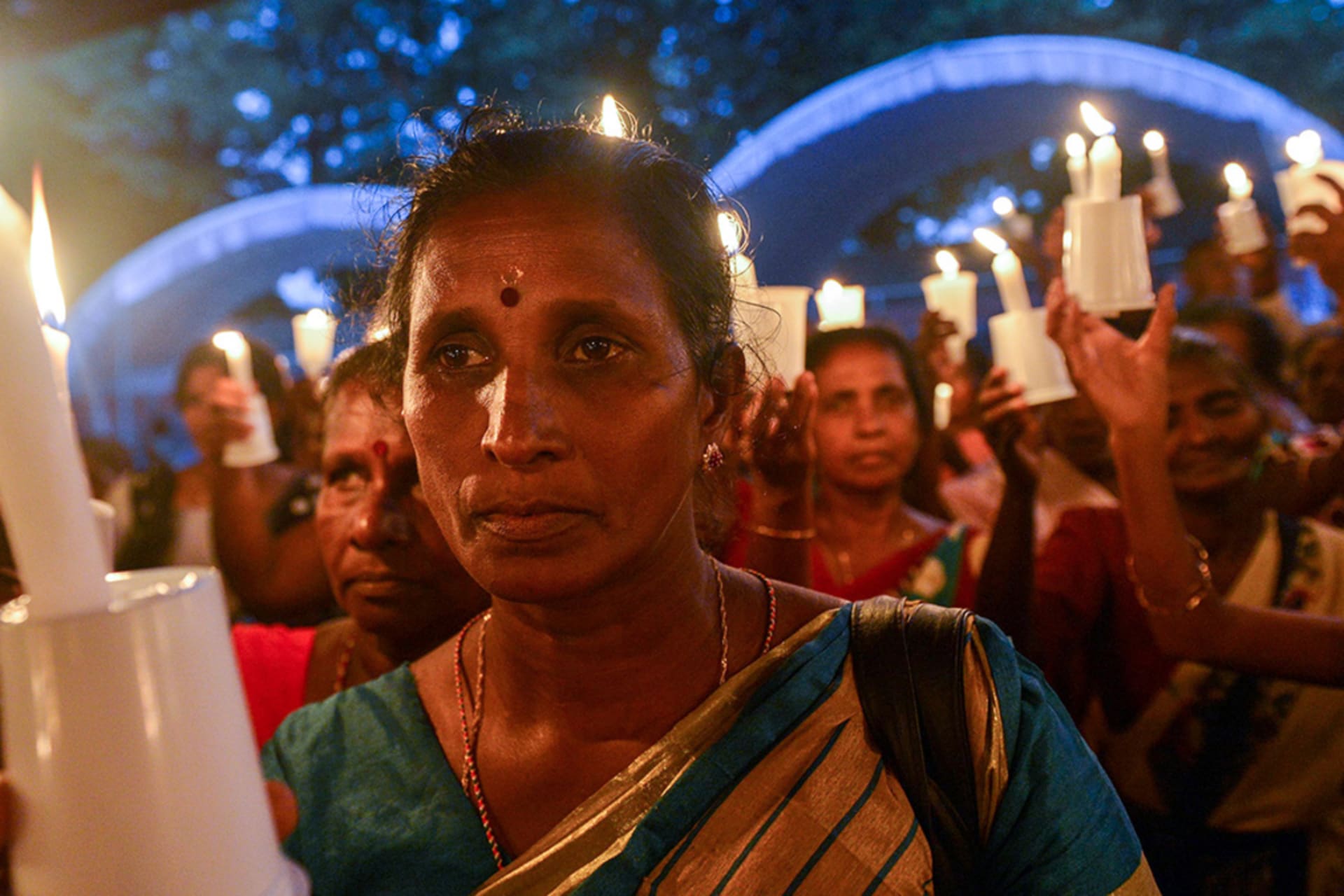 <p>A woman at a candlelight vigil in Colombo, Sri Lanka in 2017, in remembrance of the minority Tamils missing since the Sri Lankan civil war ended in 2009.</p>
