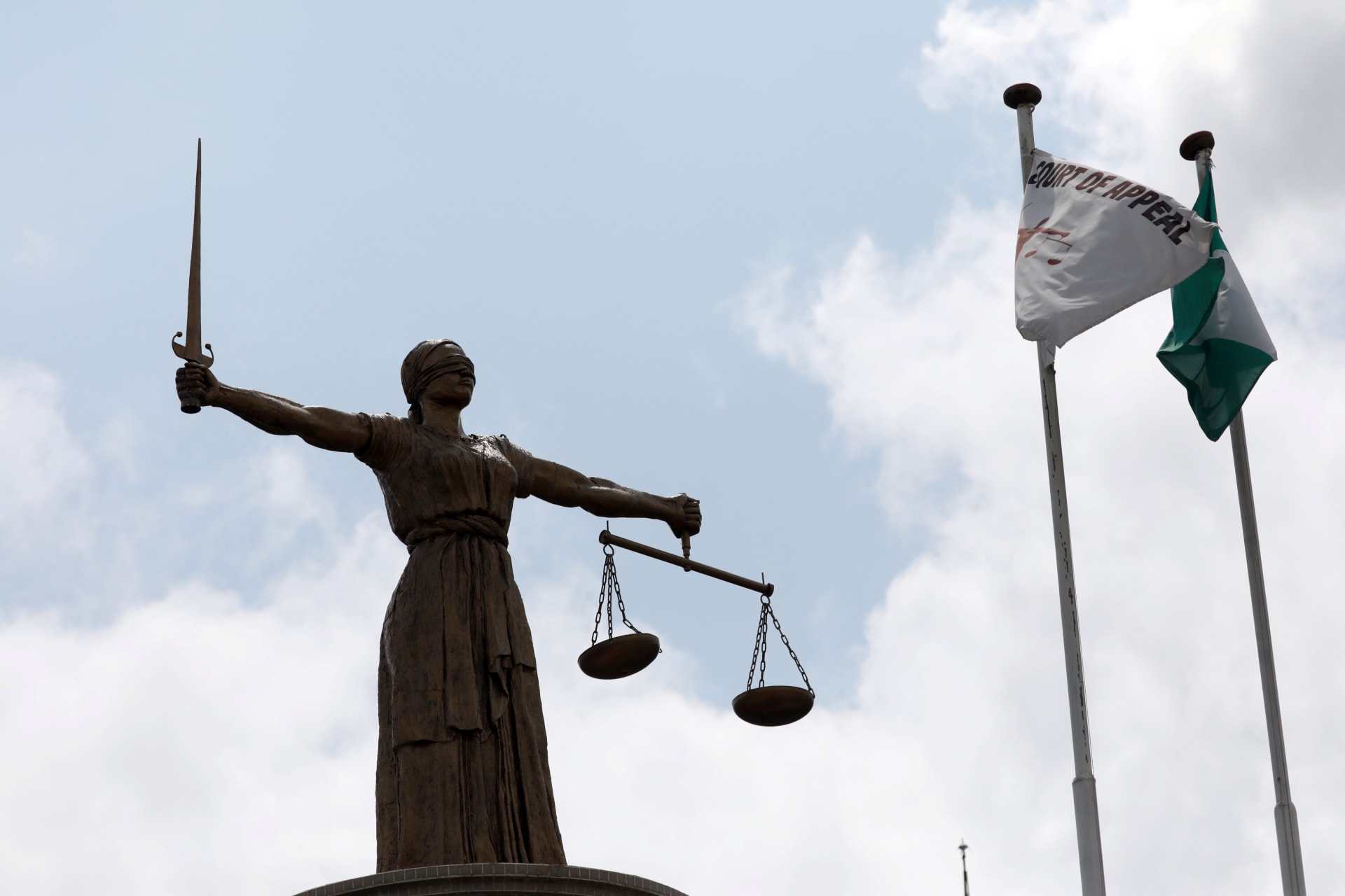 <p>A Lady Justice statue stands outside the Court of Appeal in Abuja, Nigeria, on September 11, 2019.</p>