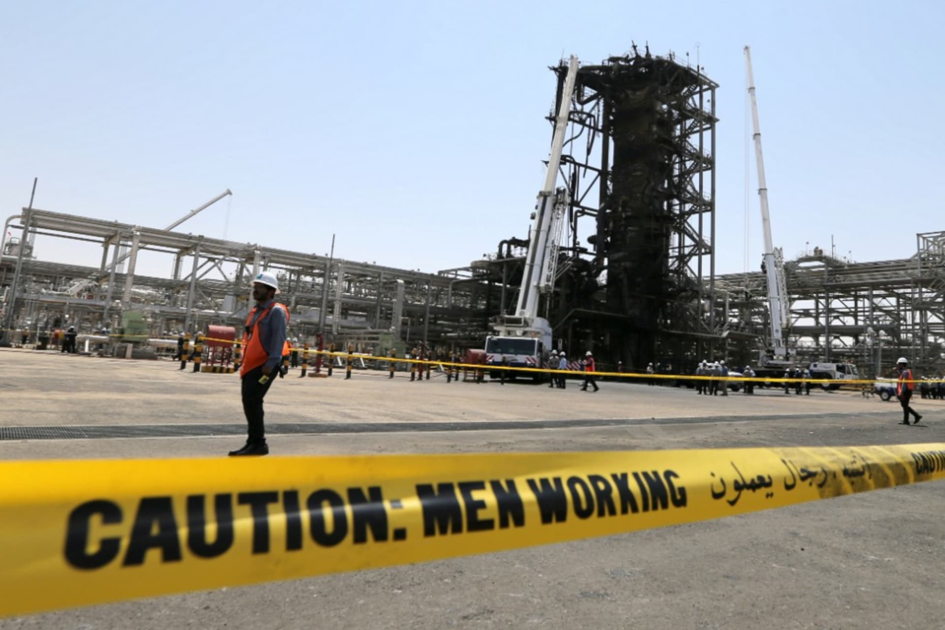 <p>Workers at the damaged site of Saudi Aramco oil facility in Khurais, Saudi Arabia, September 20, 2019. </p>
