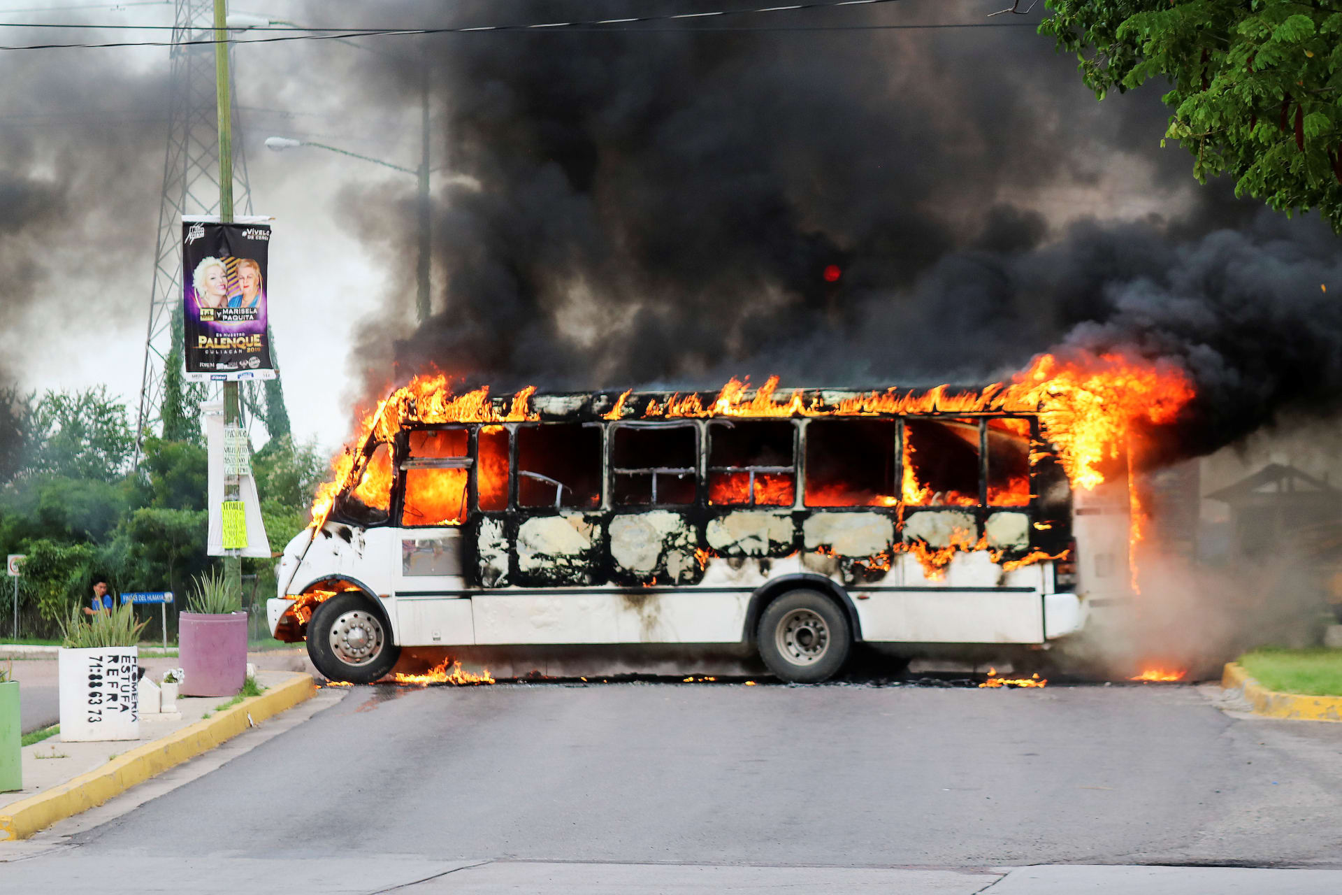<p>A burning bus, set alight by cartel gunmen to block a road, is pictured during clashes with federal forces following the detention of Ovidio Guzman, son of drug kingpin Joaquin “El Chapo” Guzman, in Culiacan, Sinaloa state, Mexico October 17, 2019.</p>
