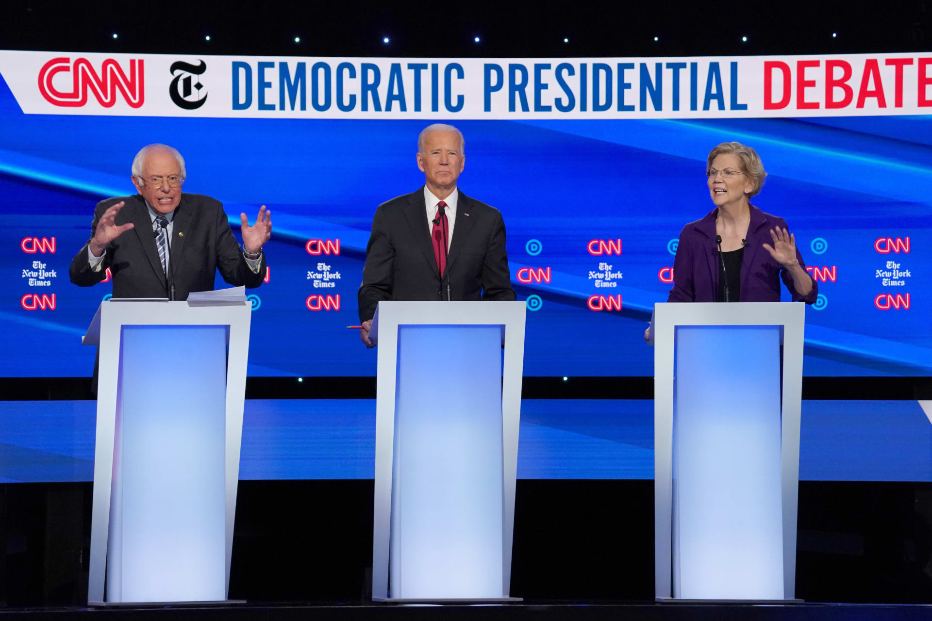 <p>Democratic presidential candidate Senator Bernie Sanders (L), former Vice President Joe Biden, and Senator Elizabeth Warren (R) debate during the fourth Democratic presidential debate in Ohio on October 15.</p>