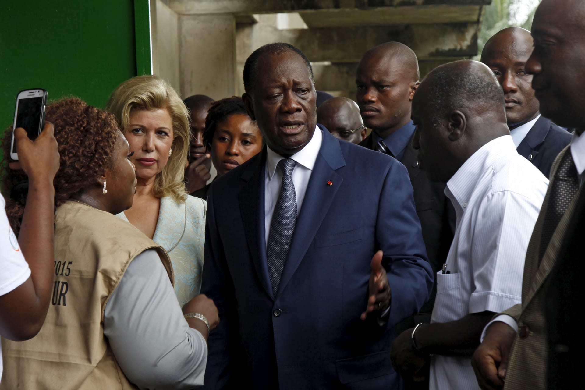 <p>Côte d’Ivoire’s President Alassane Ouattara of the Rally of the Houphouetists for Democracy and Peace (RHDP) party talks after casting his vote at a polling station during a presidential election in Abidjan, Côte d’Ivoire on October 25, 2015</p>

