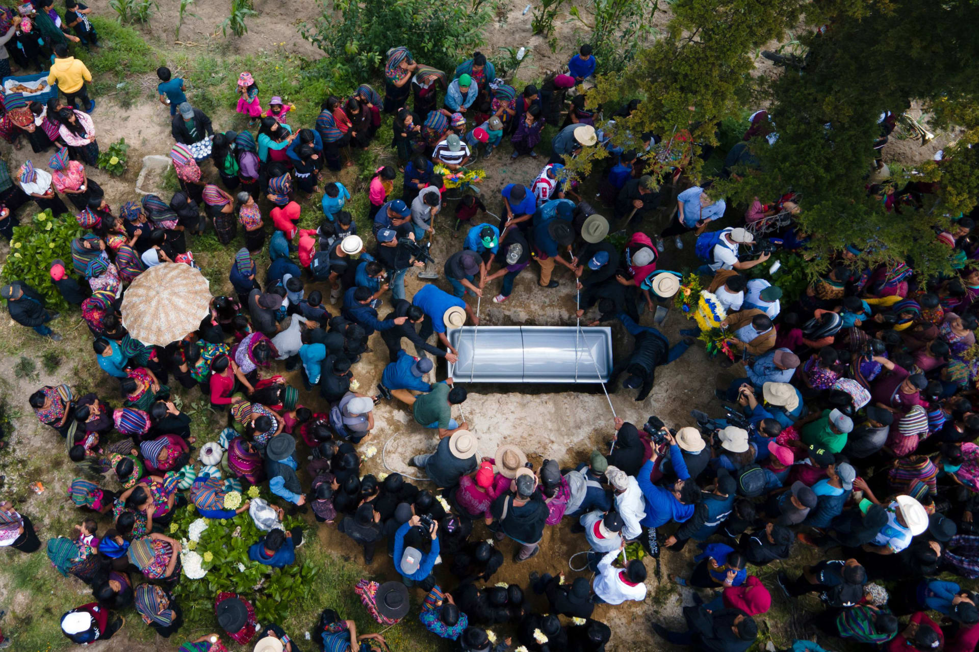 <p>The casket of a migrant teenager who suffocated in a truck in Texas is buried in Guatemala.</p>
