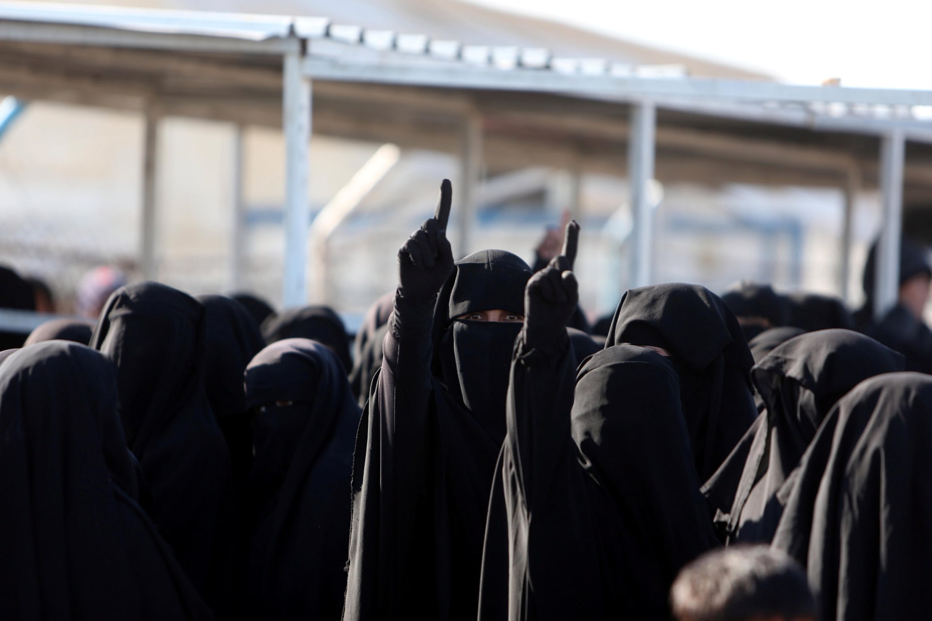 <p>Women gesture as they stand together al-Hol displacement camp in Hasaka governorate, Syria, April 2, 2019.</p>