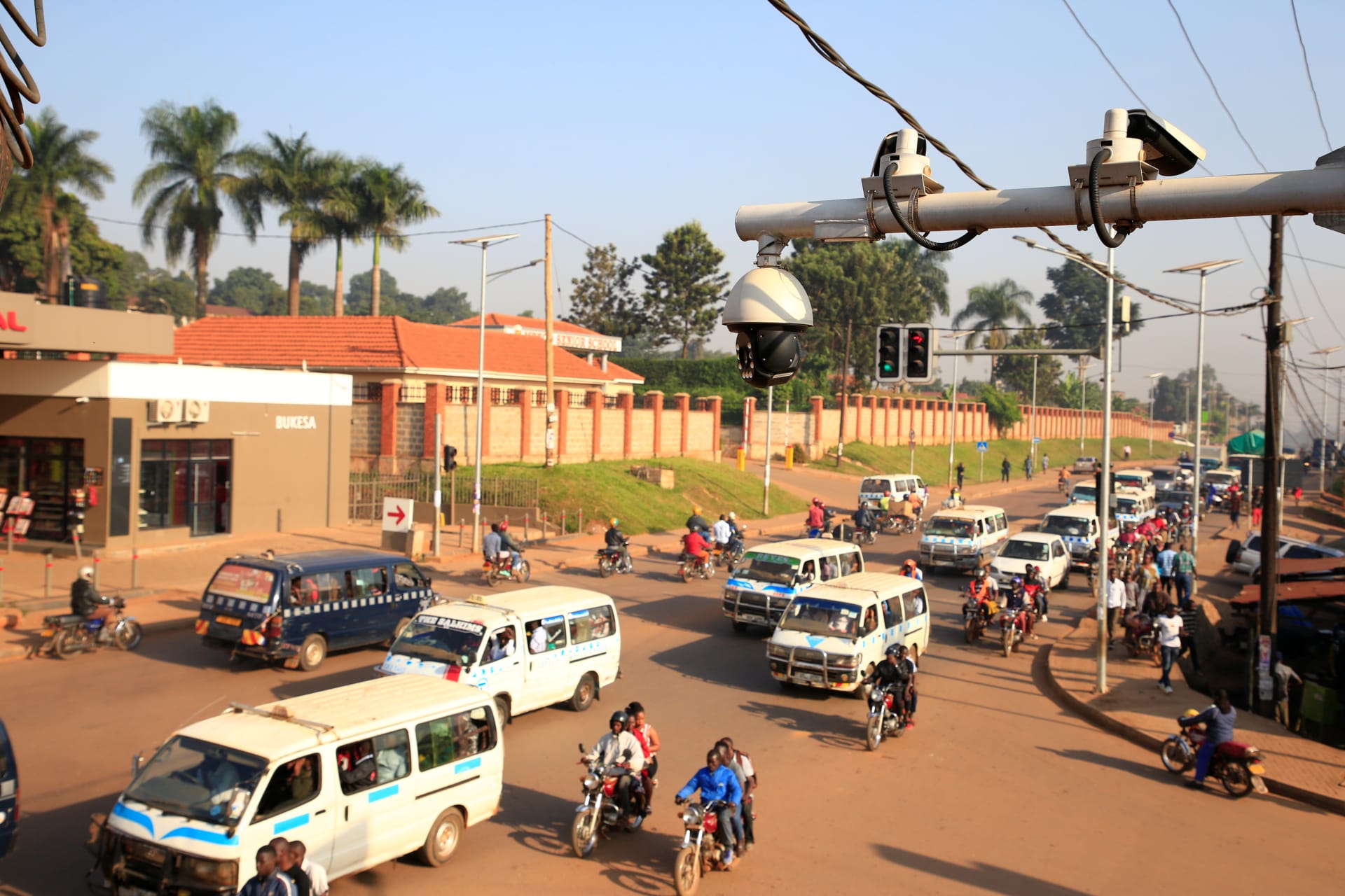 <p>Traffic flows under the surveillance closed-circuit television camera (CCTV) system along Bakuli street in Kampala, Uganda August 14, 2019.</p>
