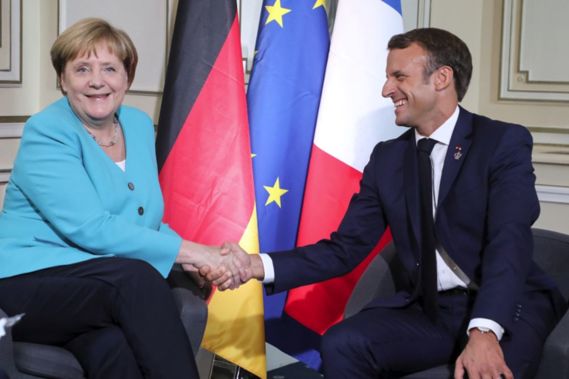 <p>German Chancellor Angela Merkel shakes hands with French President Emmanuel Macron during a bilateral meeting in Biarritz, France, on August 24, 2019.</p>

