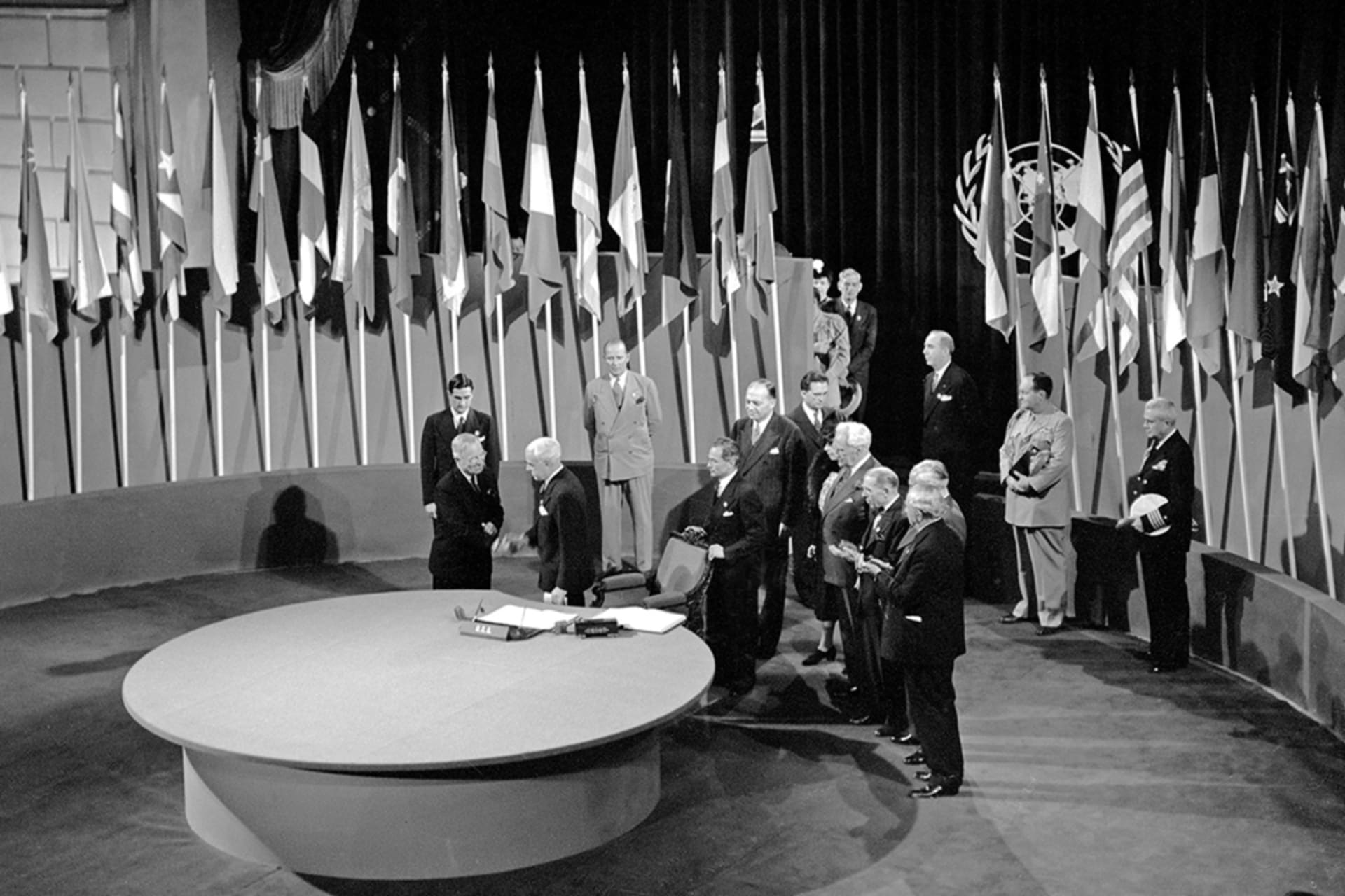 <p>U.S. President Harry S. Truman and Secretary of State Edward R. Stettinius, Jr., shake hands at the signing of the United Nations Charter in 1945.</p>
