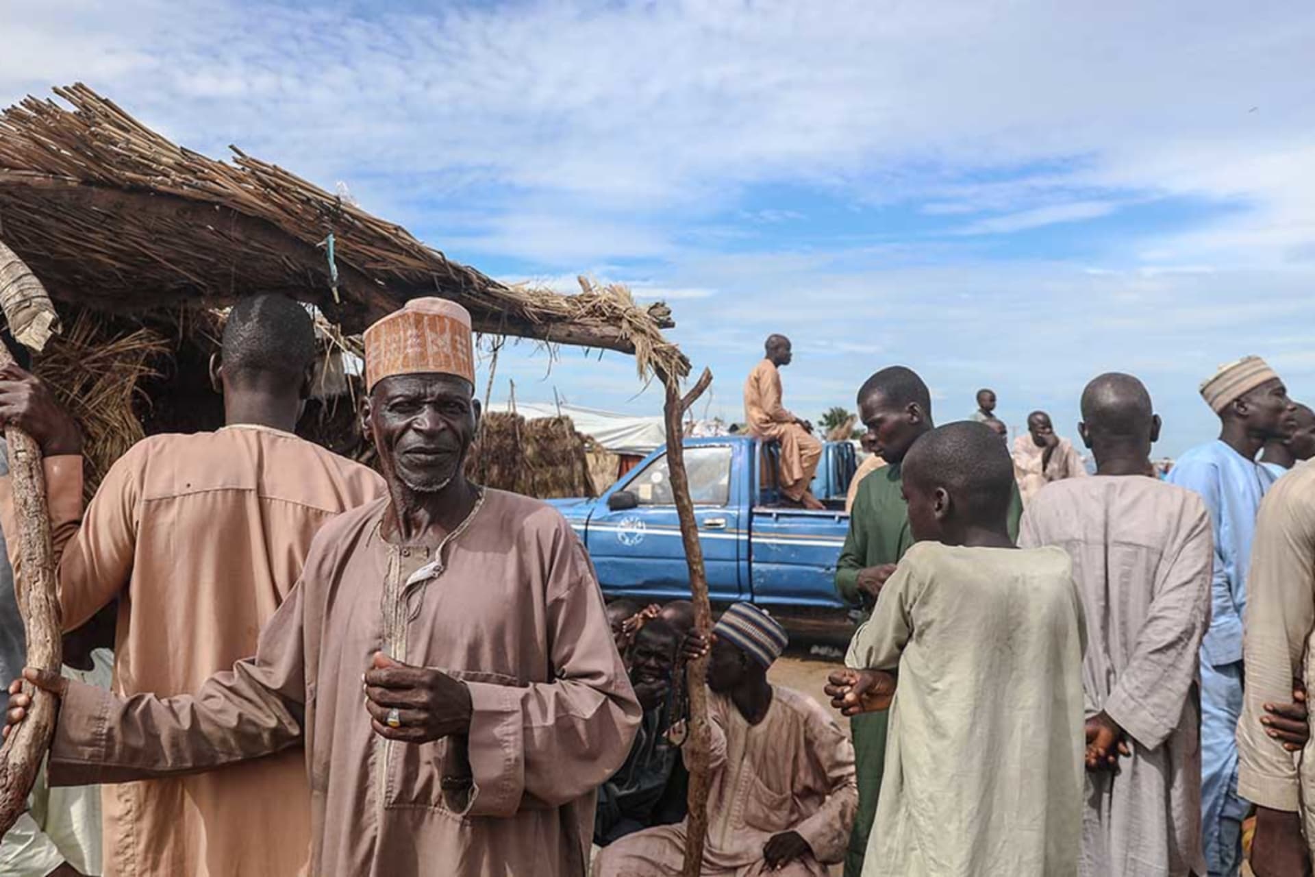 <p>Internally displaced persons gather at the Muna camp in Maiduguri, on July 21, 2019.</p>
