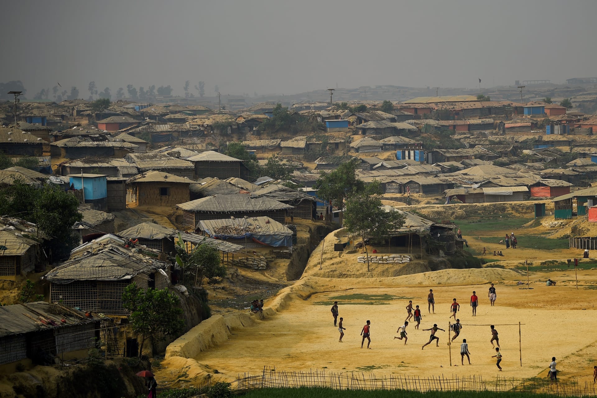 <p>Rohingya refugees play football at Kutupalong refugee camp in Cox’s Bazar, Bangladesh, on March 27, 2018.</p>
