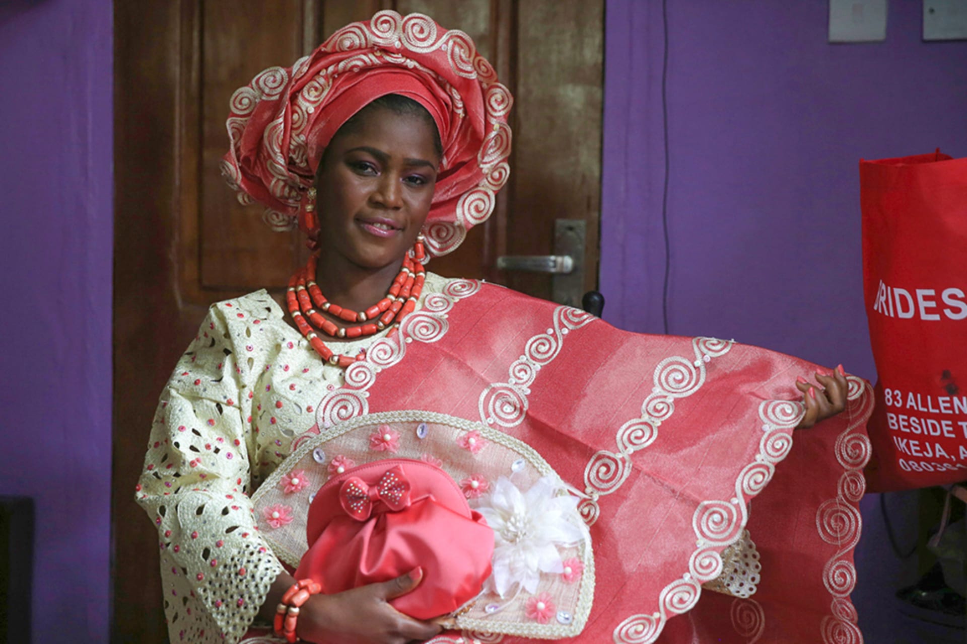 <p>Sunlola Ogungbadero, dressed in traditional attire, poses for a photograph before the start of her traditional wedding in Surulere district, Lagos, Nigeria, on July 31, 2014.</p>
