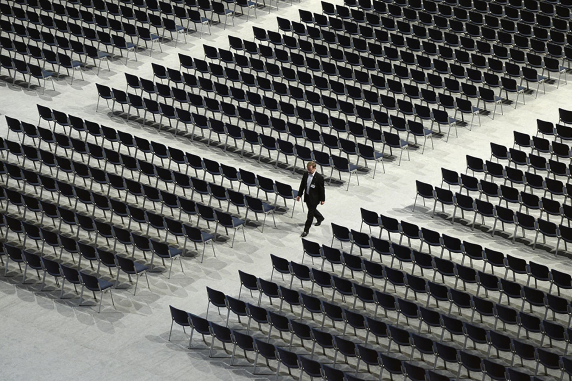 <p>A man walks between empty seats ahead the shareholders meeting of the German engineering giant Siemens in the Olympic hall in Munich, southern Germany, on January 27, 2015. </p>

