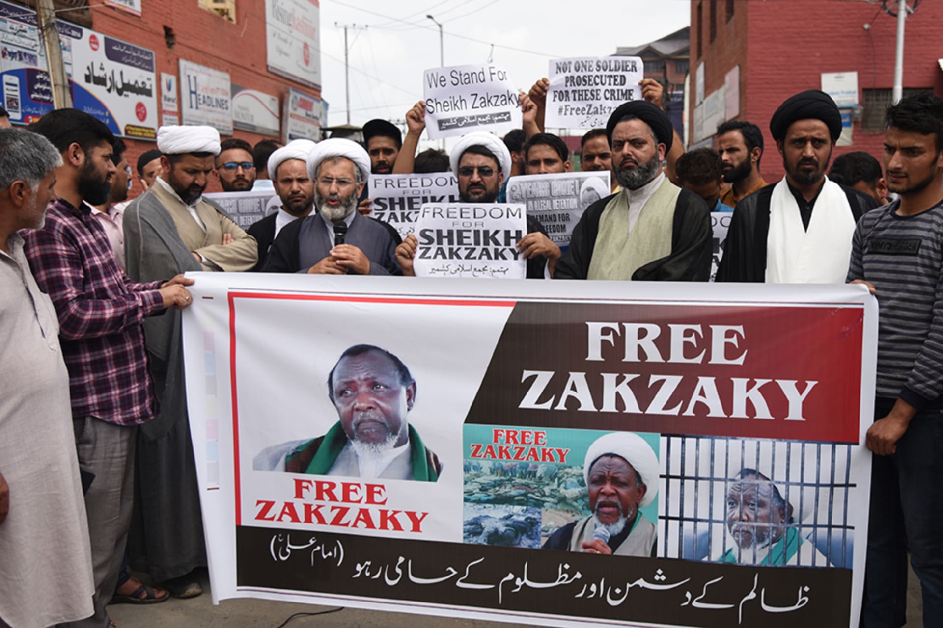 <p>Kashmiri Shia Muslim demonstrators hold a banner during a protest in Srinagar, Kashmir, on July 26, 2019.</p>

