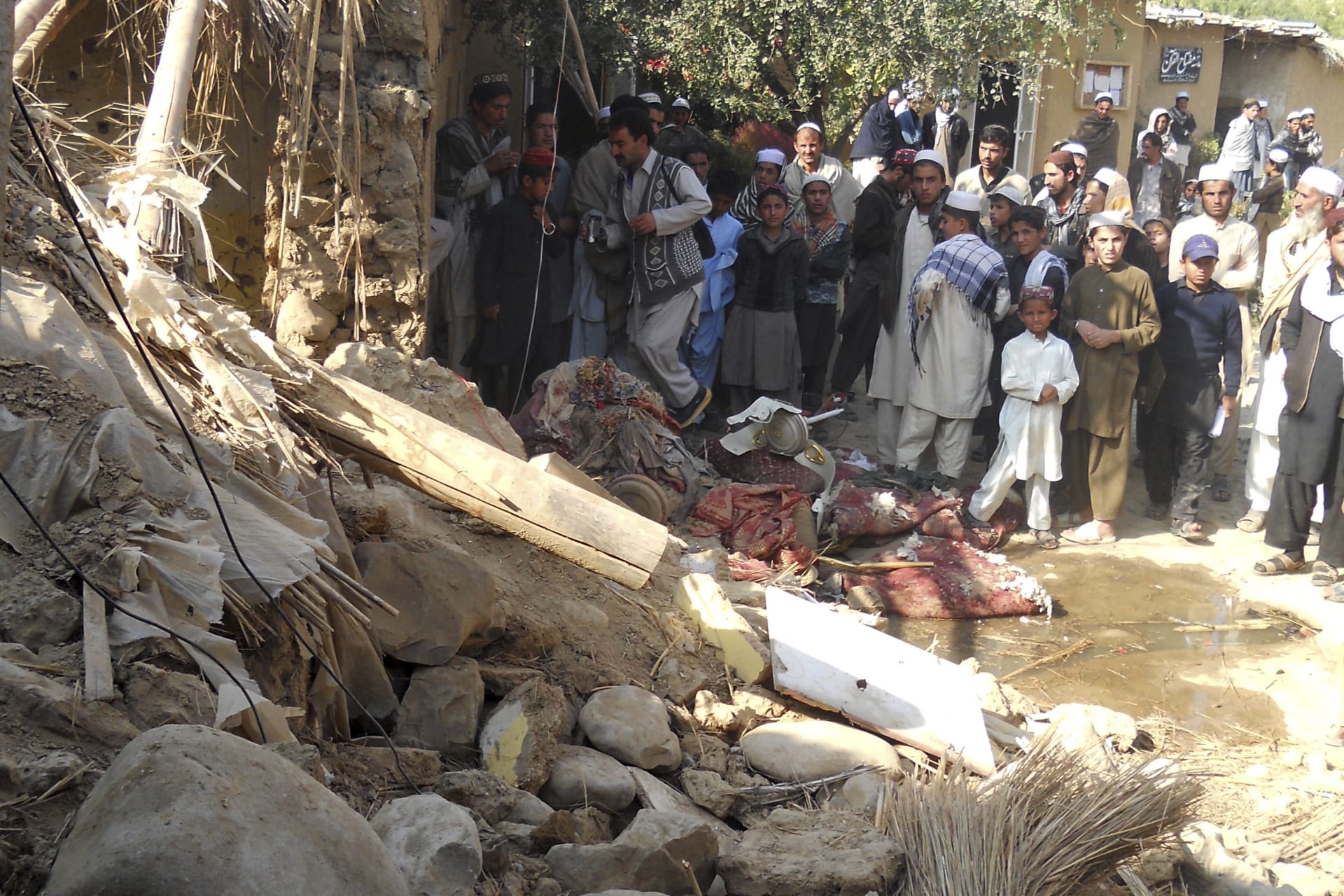 <p>Students at the site of a suspected U.S. drone strike in Khyber Pakhtunkhwa, Pakistan, in 2013.  The strike killed a senior member of the Haqqani network.</p>
