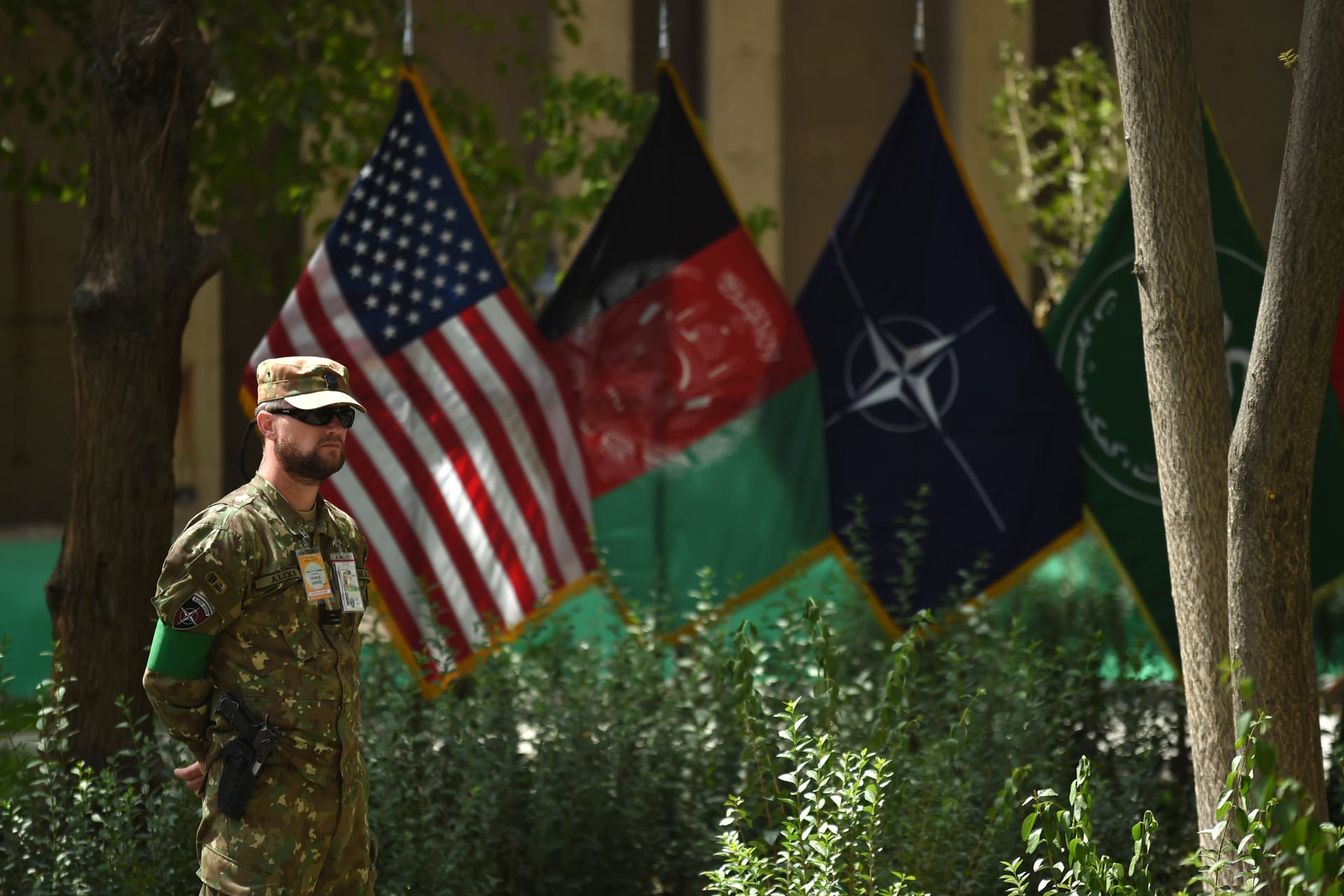 A member of the NATO military forces stands guard during a change of command ceremony at Resolute Support in Kabul on September 2, 2018.