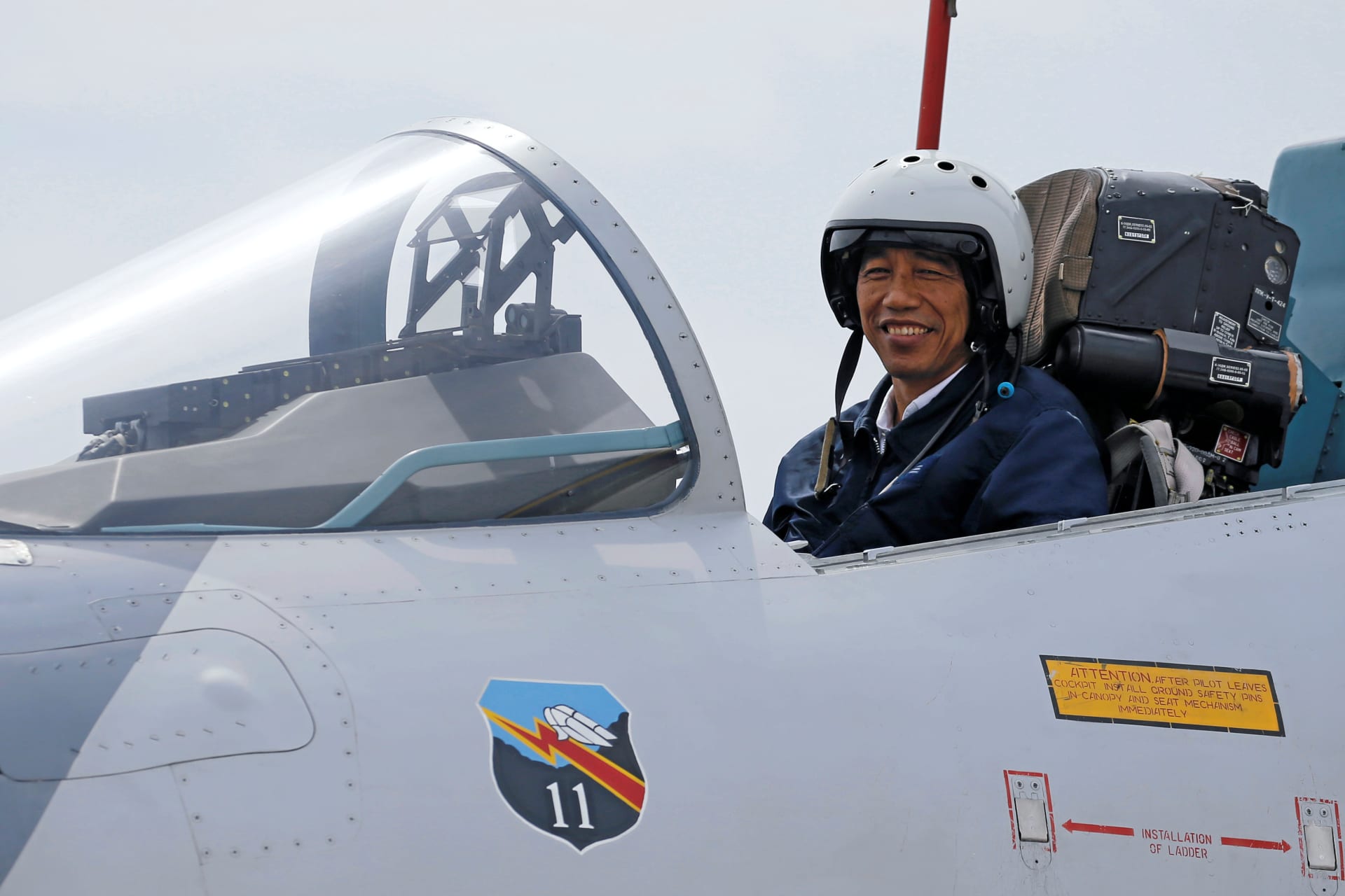 <p>Indonesia’s President Joko Widodo sits in the cockpit of a Sukhoi fighter jet while attending a military exercise at Ranai military airbase in Natuna Island, Riau Islands province, Indonesia on October 6, 2016.</p>

