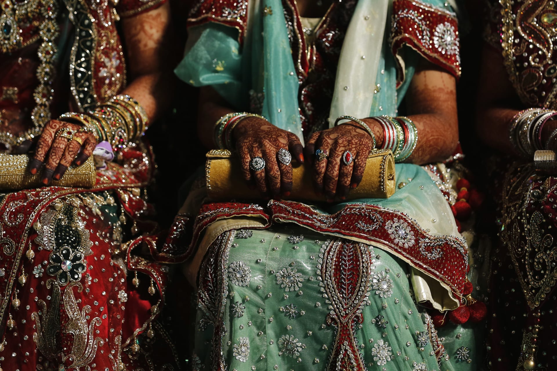<p>Muslim brides wait for the start of their mass marriage ceremony in Mumbai, India. May 11, 2014.</p>
