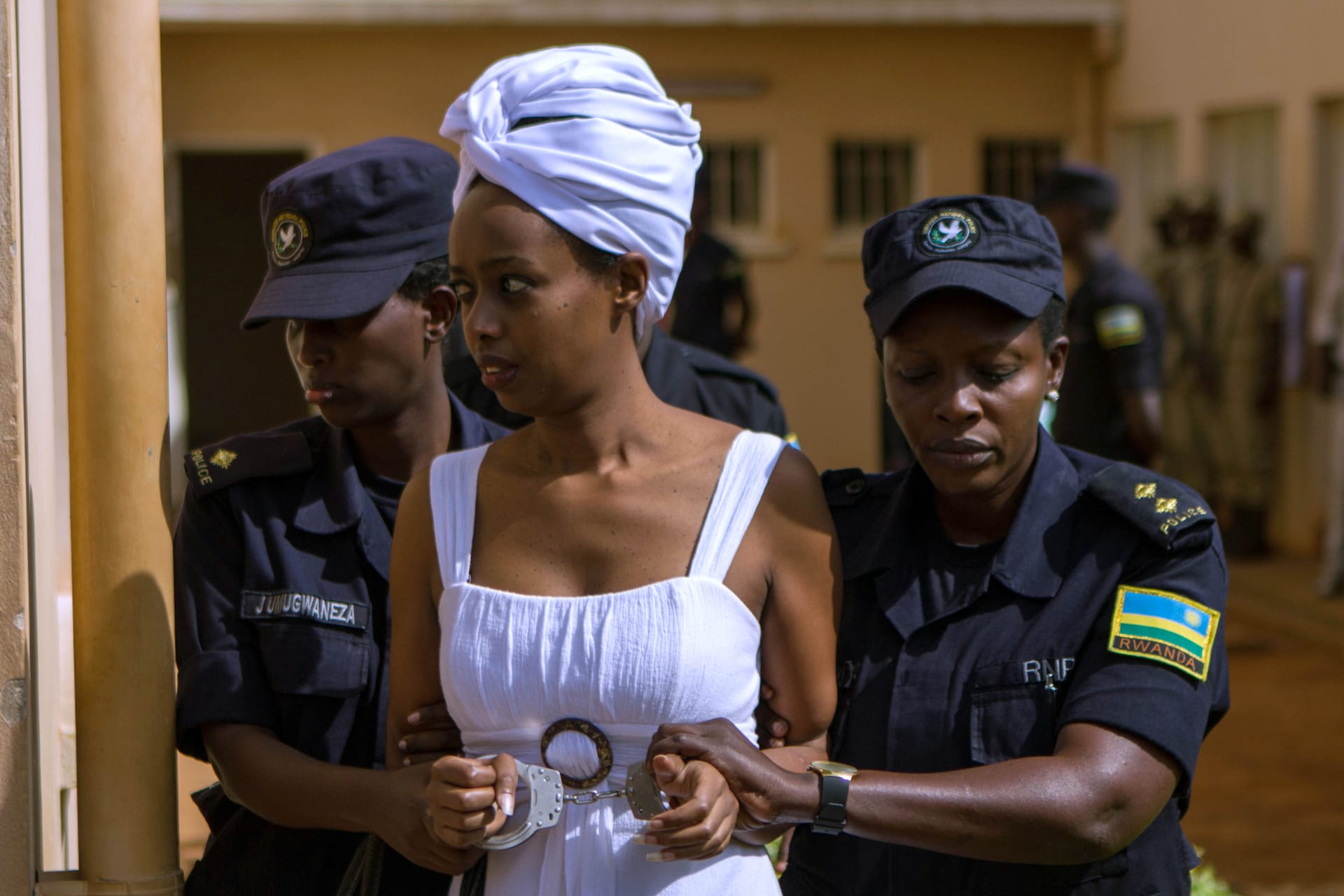 <p>Diane Shima Rwigara, a prominent critic of Rwandan President Paul Kagame, is escorted by police officers into a courtroom in Kigali, Rwanda, on October 11, 2017.</p>
