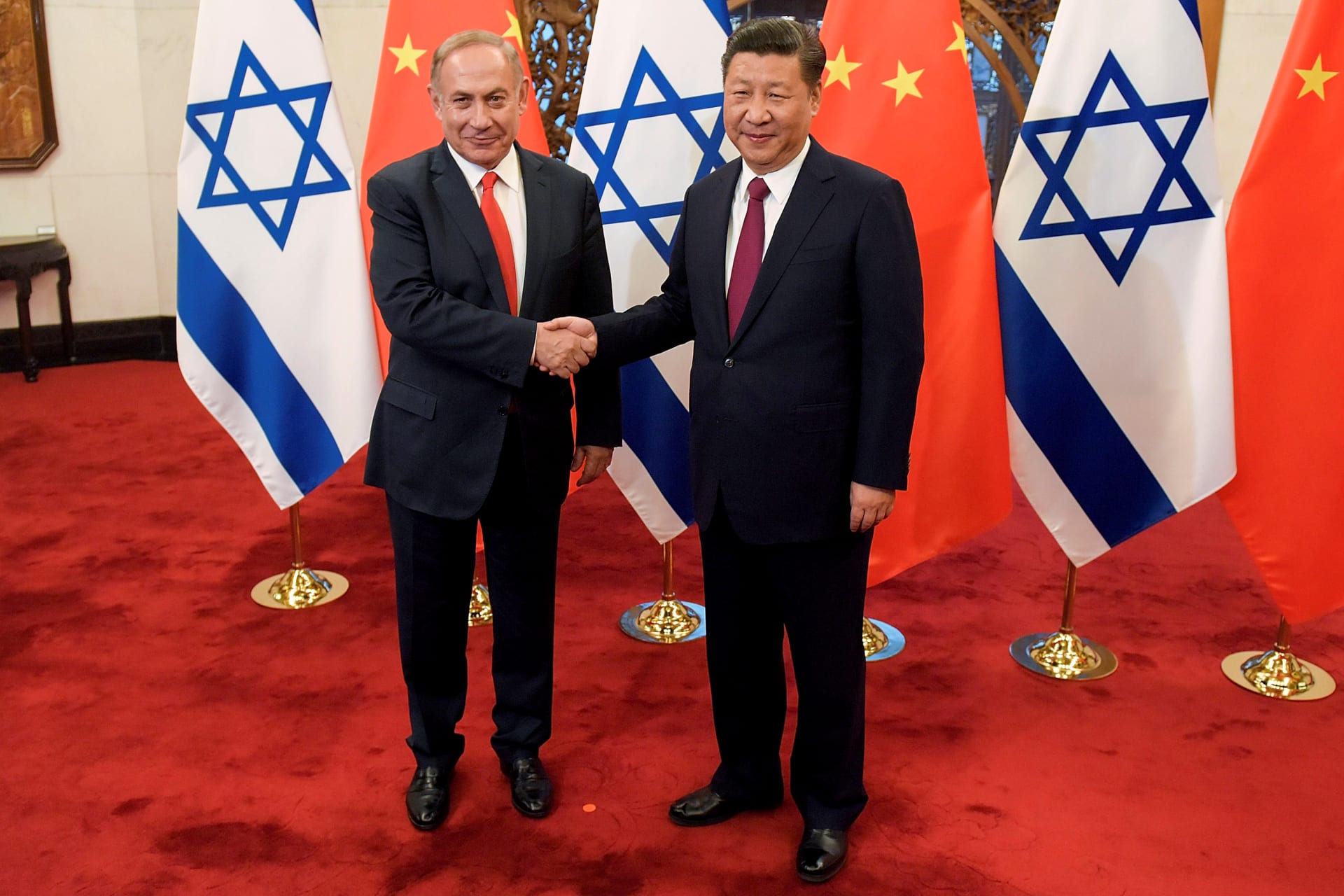 <p>Chinese President Xi Jinping and Israeli Prime Minister Benjamin Netanyahu shake hands ahead of their talks at Diaoyutai State Guesthouse in Beijing, China March 21, 2017. </p>
