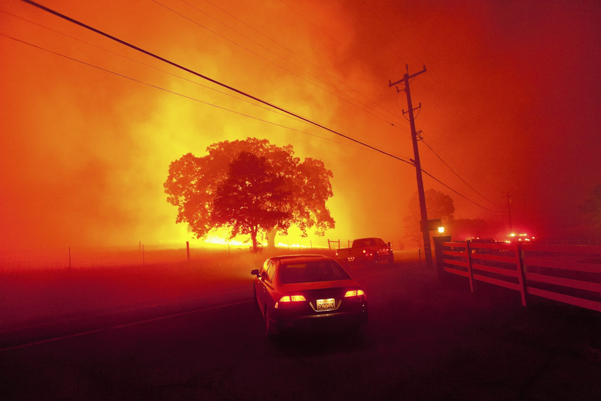 <p>Residents flee as winds whip flames from the Morgan fire near Clayton, California on September 9, 2013.</p>
