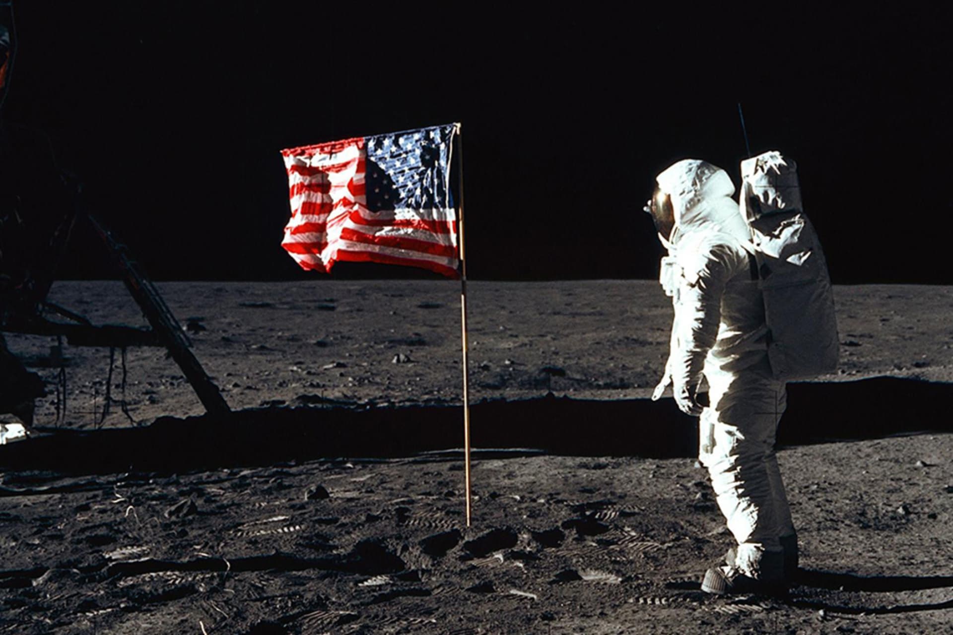 <p> Astronaut Edwin E. Aldrin Jr., lunar module pilot of the first lunar landing mission, poses for a photograph beside the deployed U.S. flag on the lunar surface. </p>
