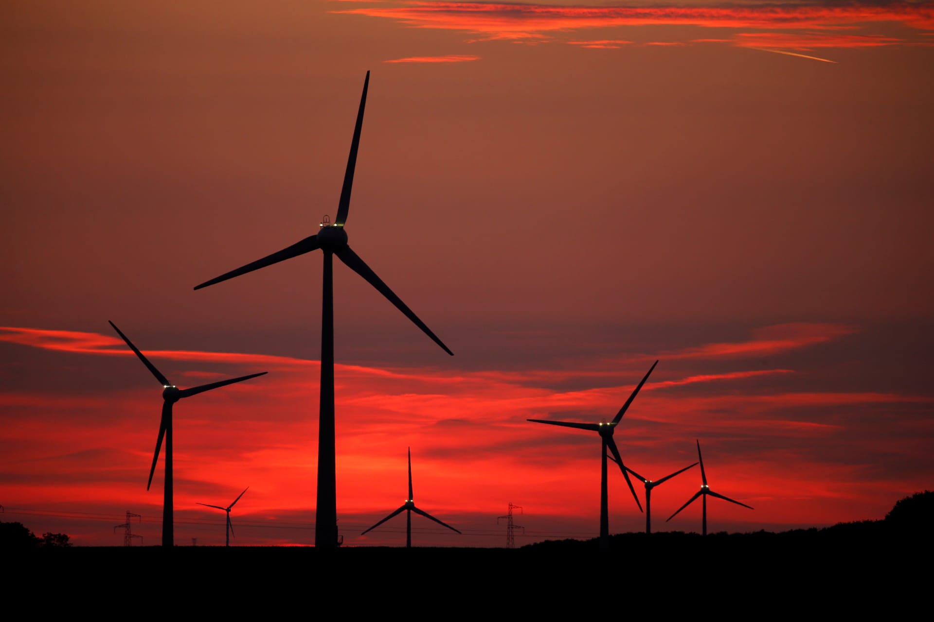 <p>Power-generating windmill turbines are pictured at sunset at a wind park in Cagnicourt near Cambrai, France, May 22, 2019.</p>
