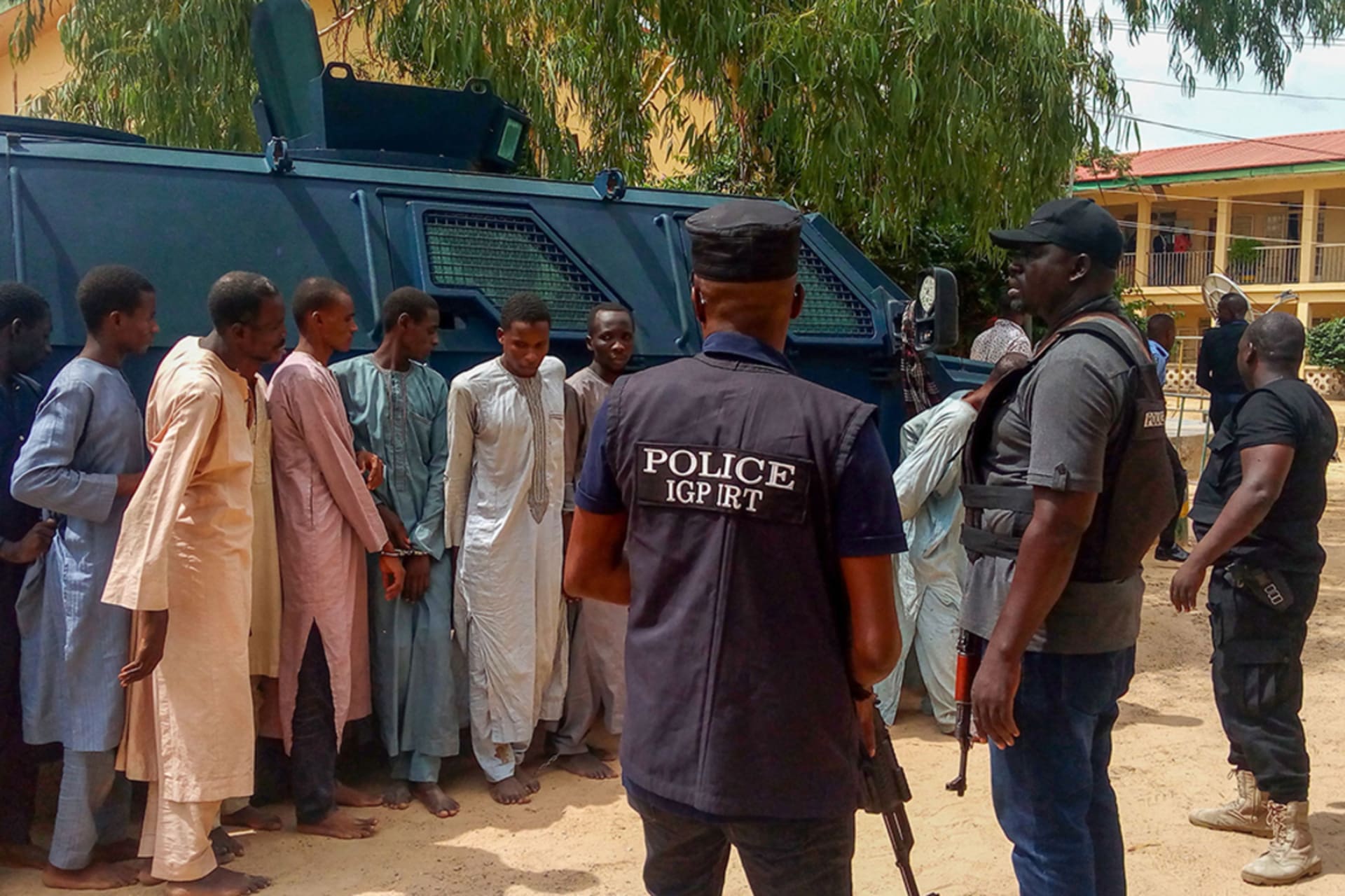 <p>Police officers outline suspected Boko Haram militants in Maiduguri, northeast Nigeria, on July 18, 2018.</p>

