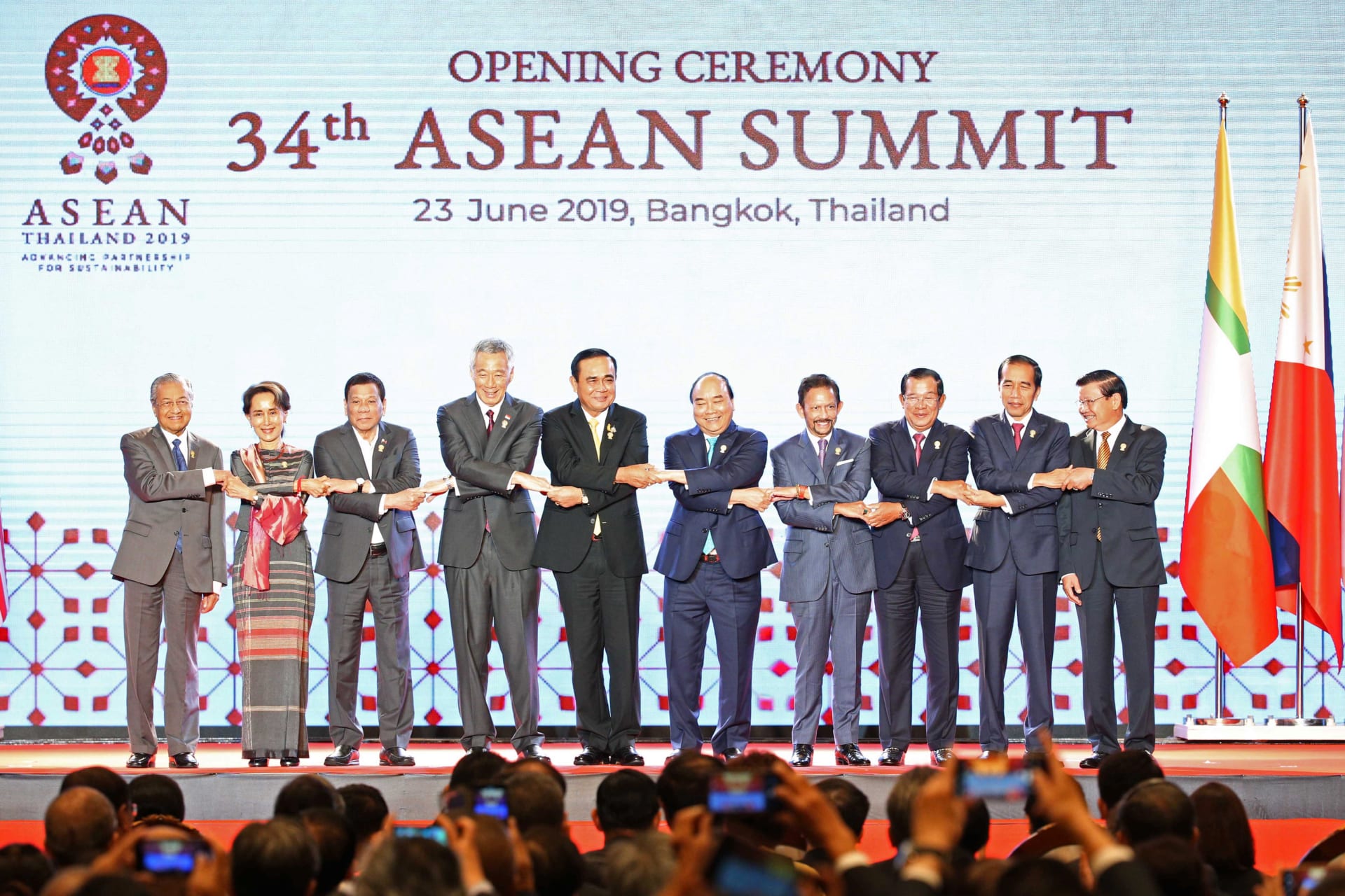 <p>ASEAN leaders shake hands on stage during the opening ceremony of the 34th ASEAN Summit at the Athenee Hotel in Bangkok, Thailand on June 23, 2019</p>
