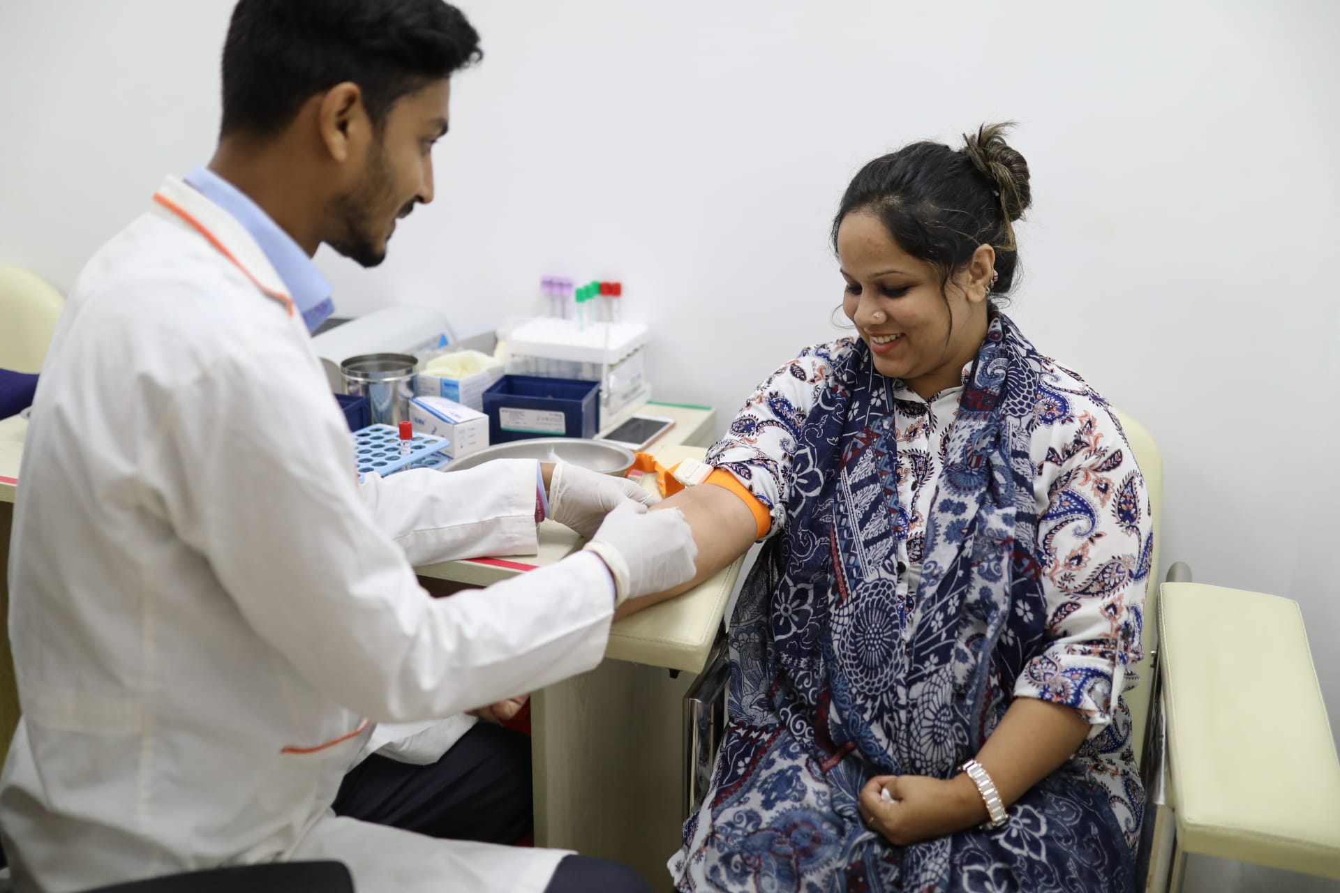 <p>A woman sees a doctor at a Praava Health facility in Bangladesh.</p>
