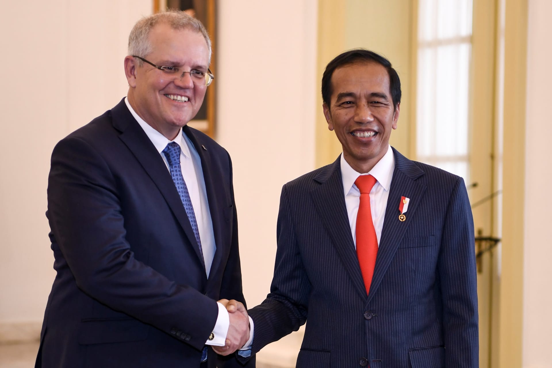 <p>Indonesian President Joko Widodo shakes hands with Australian Prime Minister Scott Morrison at the presidential palace in Bogor, south of Jakarta, Indonesia on August 31, 2018.</p>