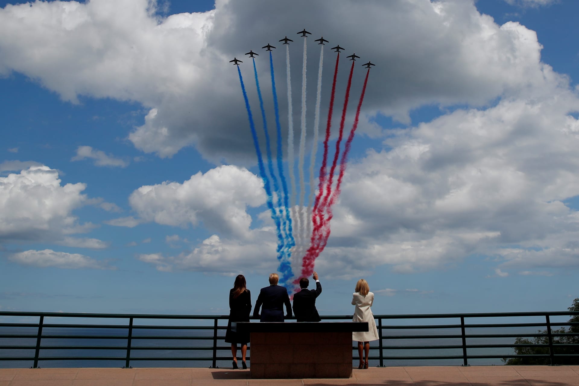 <p>U.S President Donald J. Trump, First Lady Melania Trump, French President Emmanuel Macron, and his wife Brigitte Macron look to flypasts to commemorate the 75th anniversary of the D-Day landings in Normandy, France, June 6, 2019.</p>

