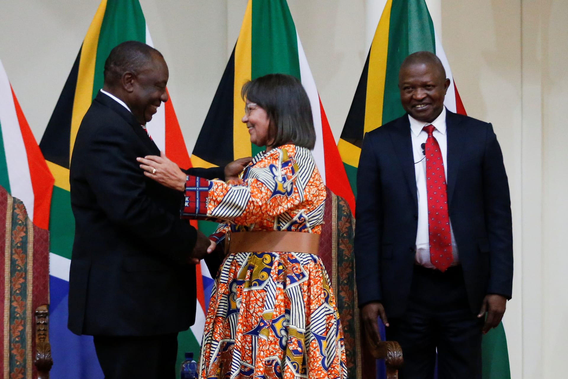 <p>South Africa’s Public Works and Infrastructure Minister Patricia de Lille is congratulated by President Cyril Ramaphosa after a swearing-in ceremony in Pretoria, South Africa, on May 30, 2019. </p>
