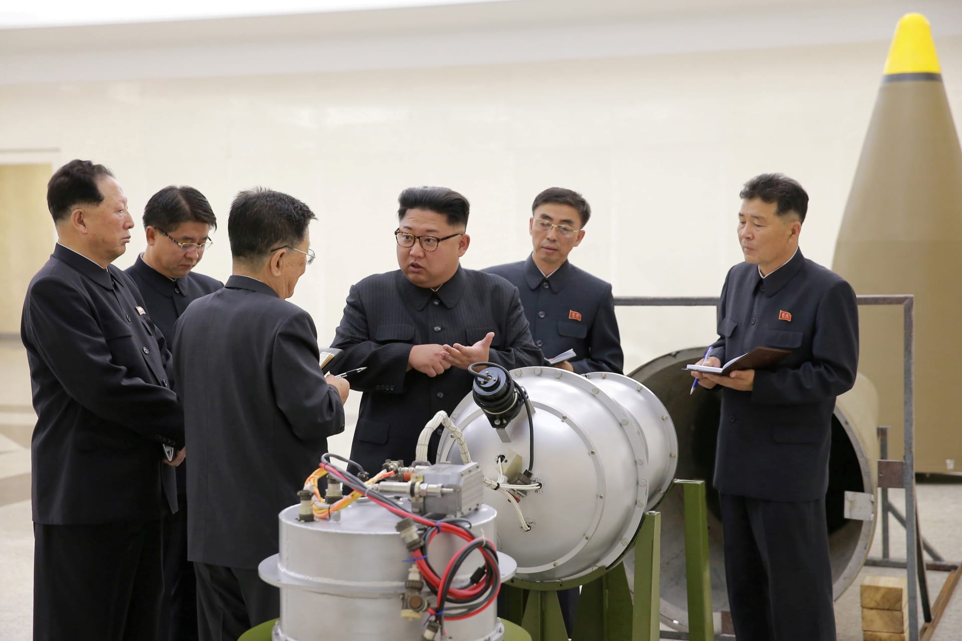 <p>North Korean leader Kim Jong-un provides guidance with Ri Hong-sop (3rd L) and Hong Sung-mu (L) on a nuclear weapons program in this undated photo released by North Korea’s Korean Central News Agency on September 3, 2017. </p>