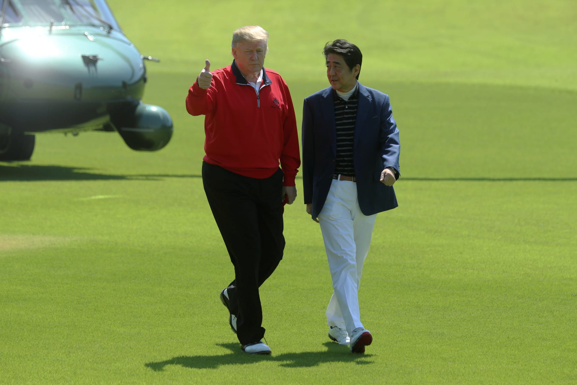 <p>Japan’s Prime Minister Shinzo Abe welcomes U.S. President Donald Trump upon his arrival at Mobara Country Club in Chiba prefecture, Japan, on May 26, 2019.</p>
