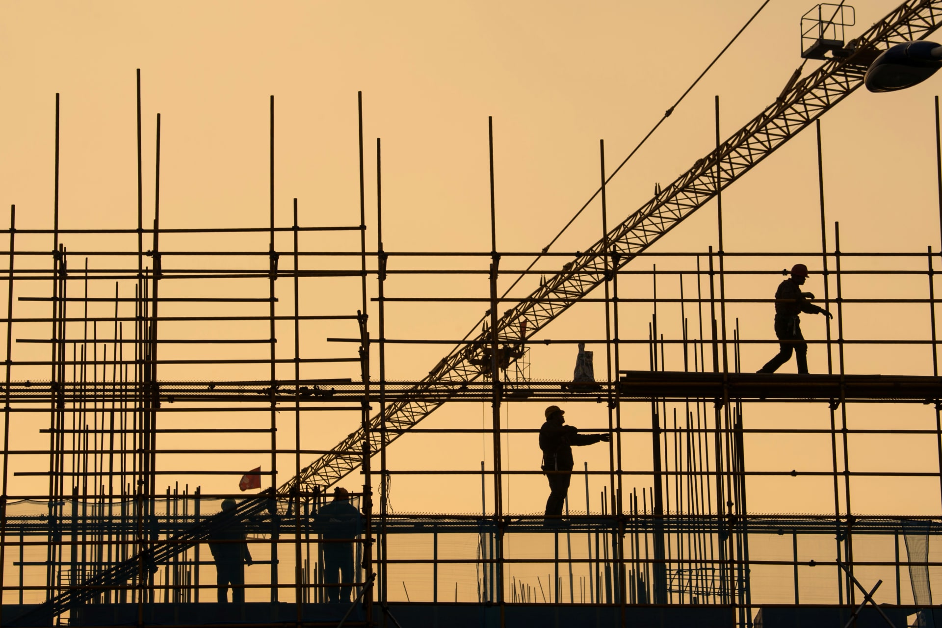 <p>Workers are seen on scaffolding at a construction site in Nantong, Jiangsu province, China, on January 1, 2019.</p>
